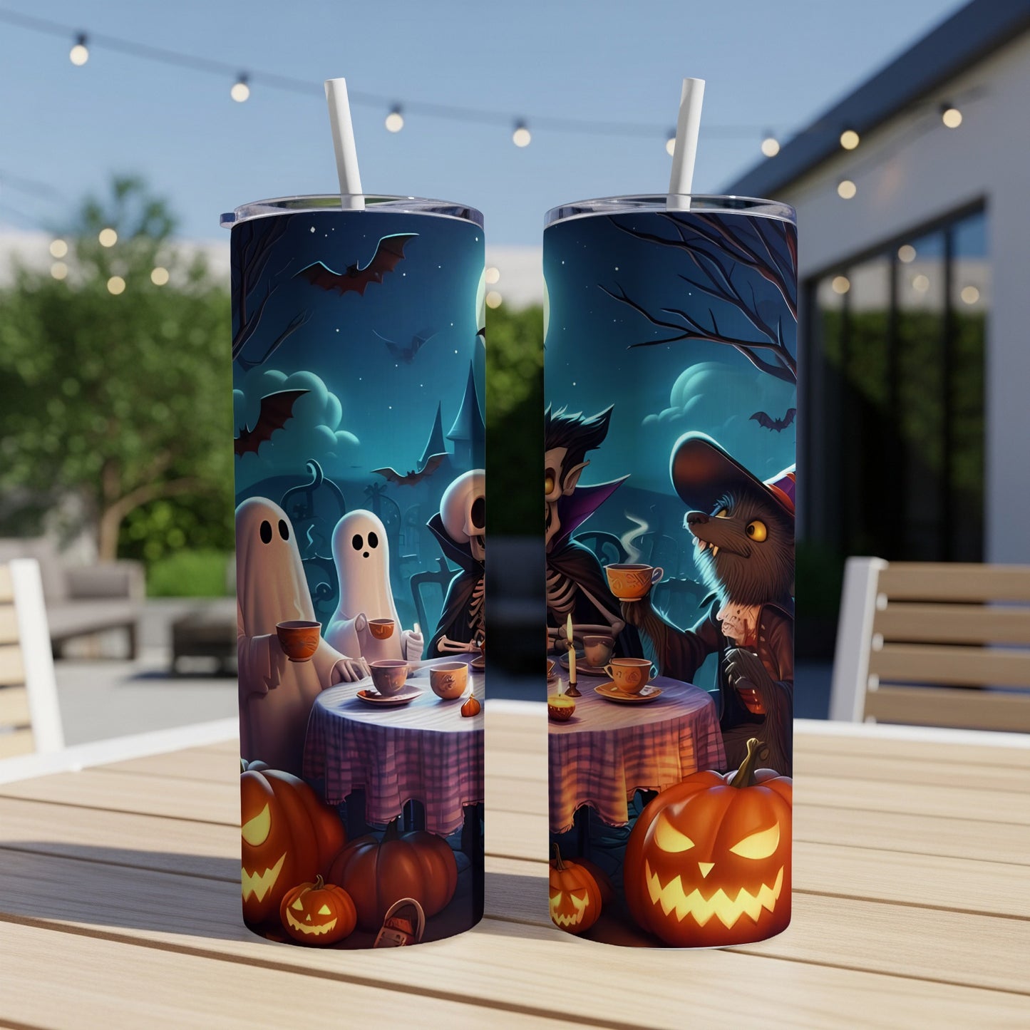 Two Halloween-themed tumblers with ghosts, skeleton, vampire, and werewolf characters enjoying tea.
