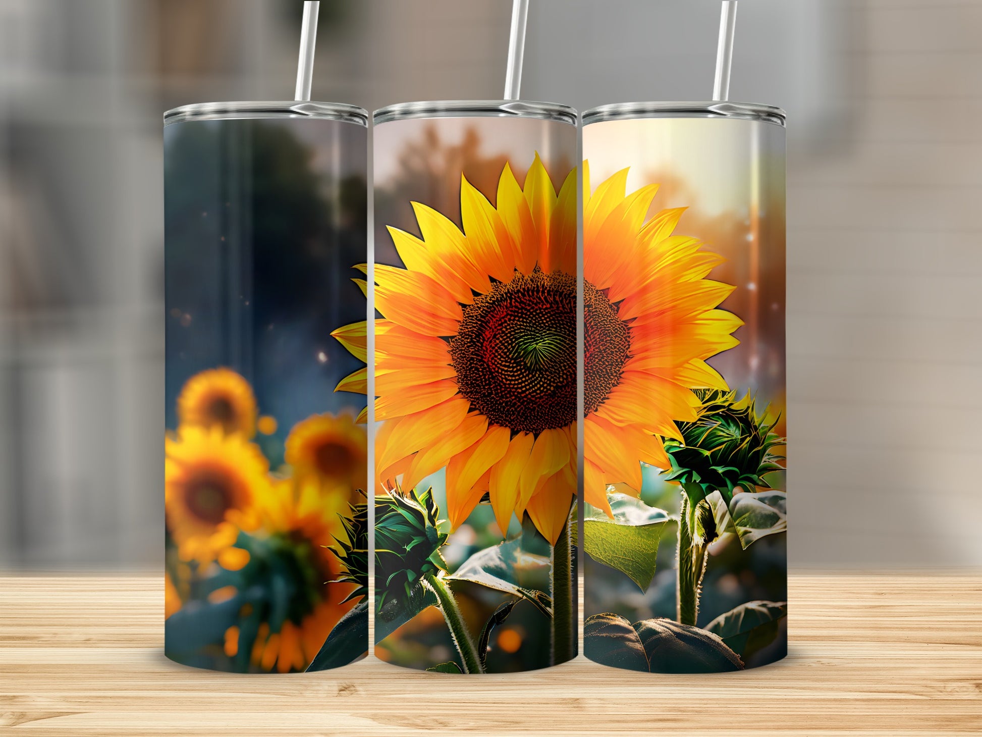 Three tumblers with sunflowers against a blurred background.