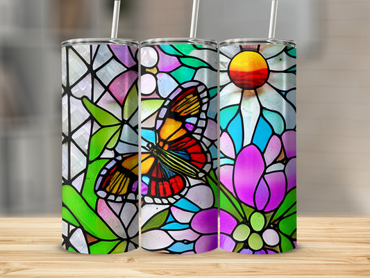 Three tumblers with stained glass butterfly and floral designs.