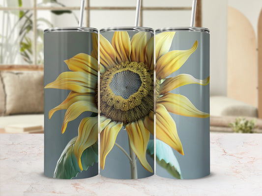 Sunflower tumbler with lid and straw, close-up.