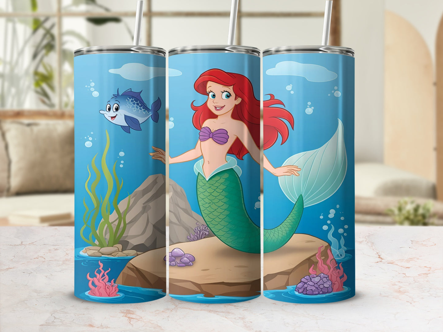Ariel the mermaid on a rock with a fish and seaweed.