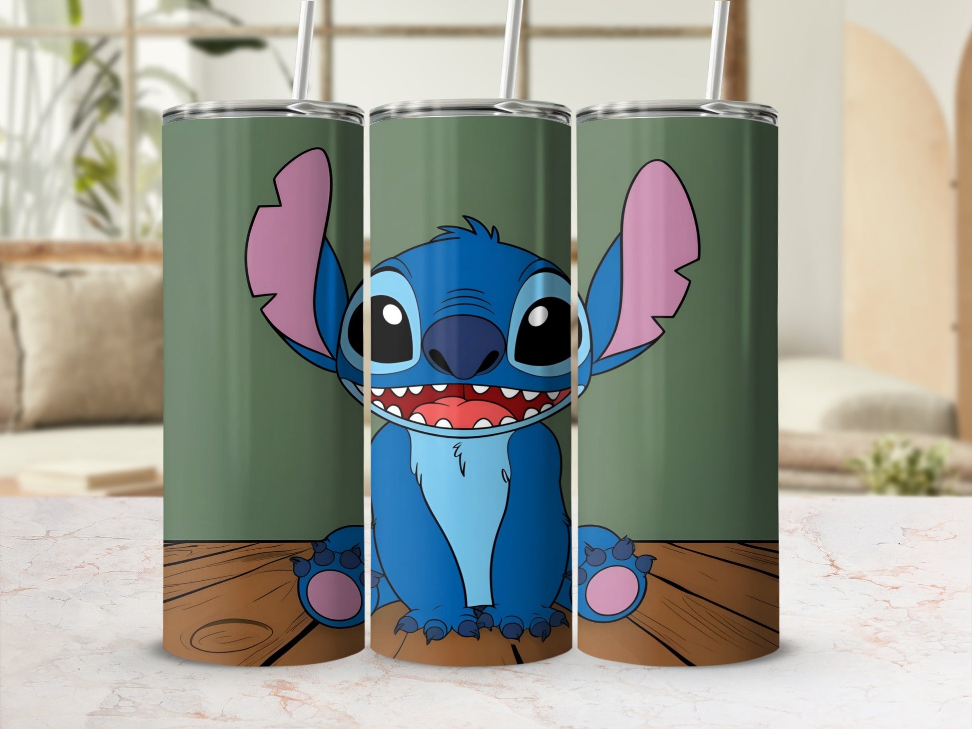 Cartoon Stitch character on three tumblers with straws.