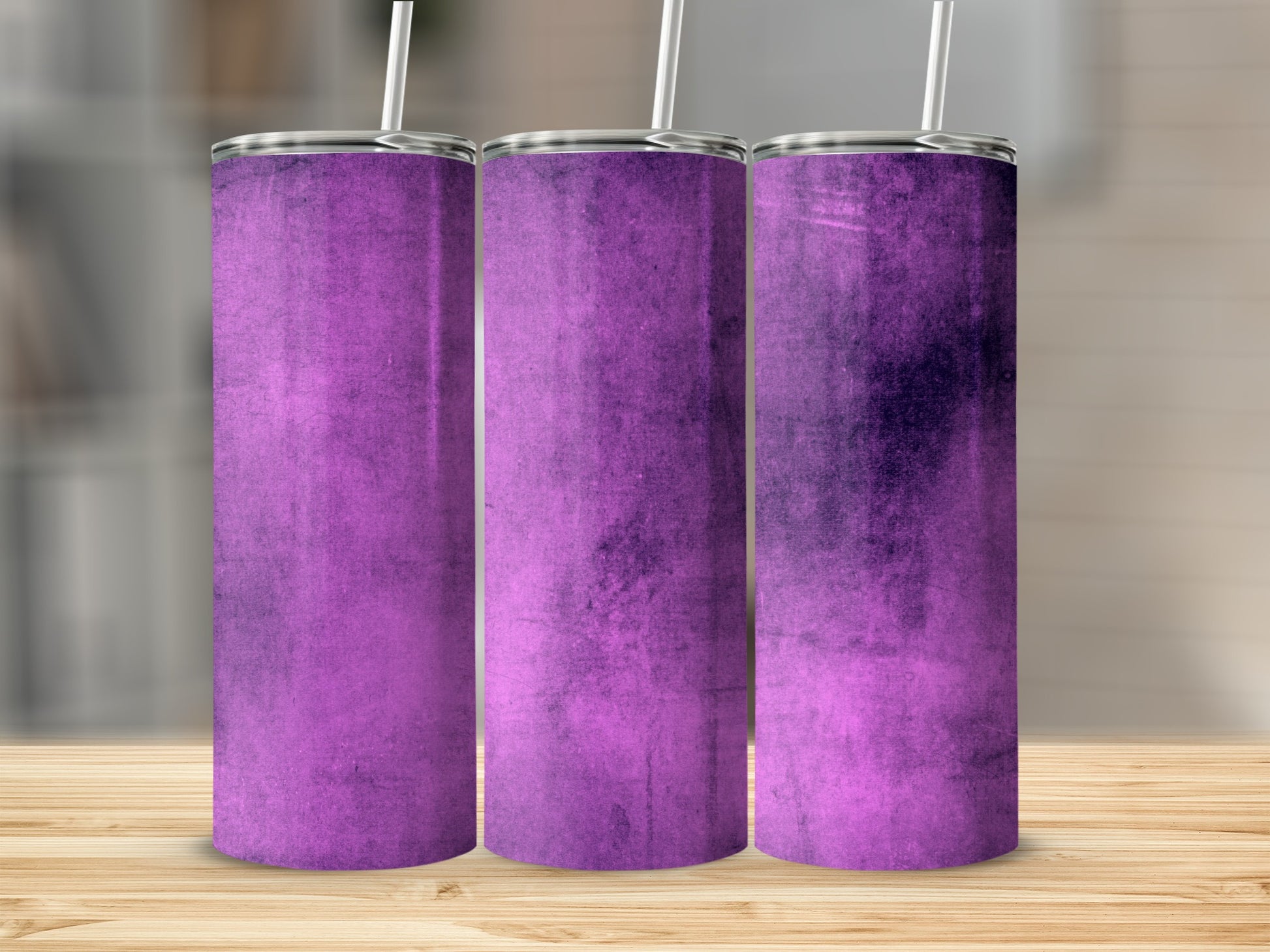 Three purple tumblers with textured surfaces and silver lids, arranged side-by-side.