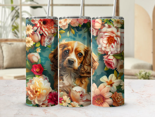 Spaniel puppy surrounded by floral arrangement on a skinny tumbler.