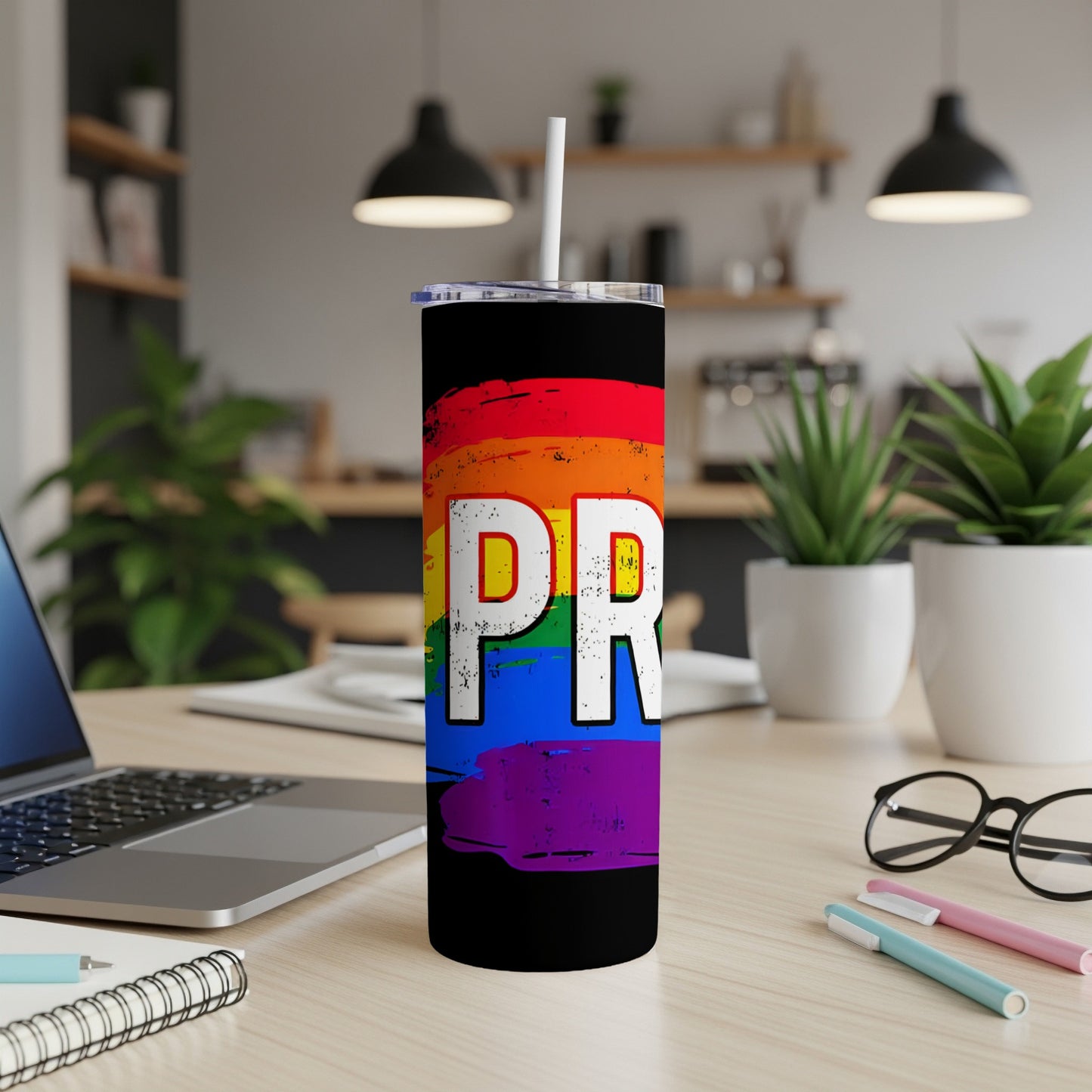 Black tumbler with rainbow flag design and "PRIDE" text.