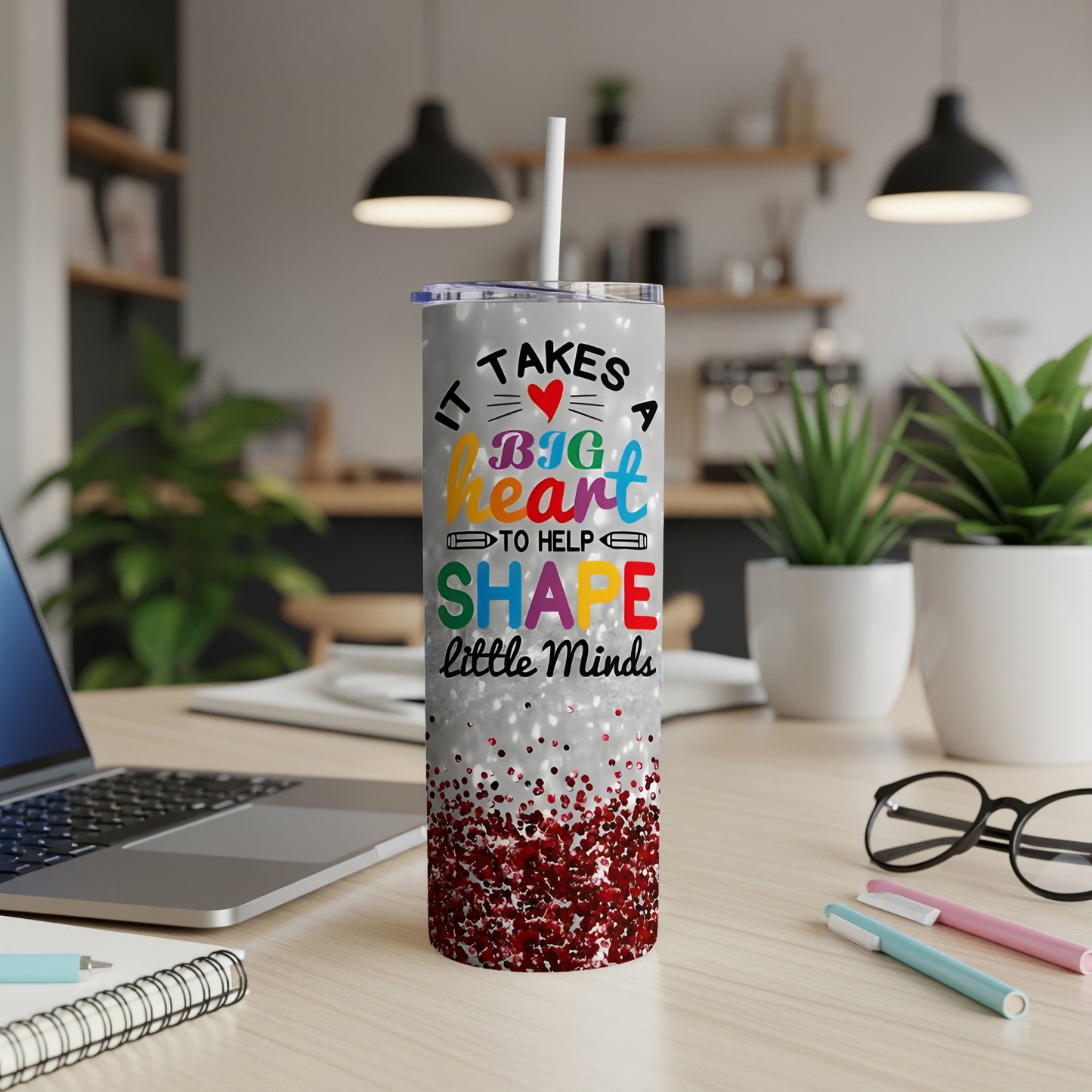 Tumbler with "It Takes a Big Heart to Help Shape Little Minds" text and glitter.