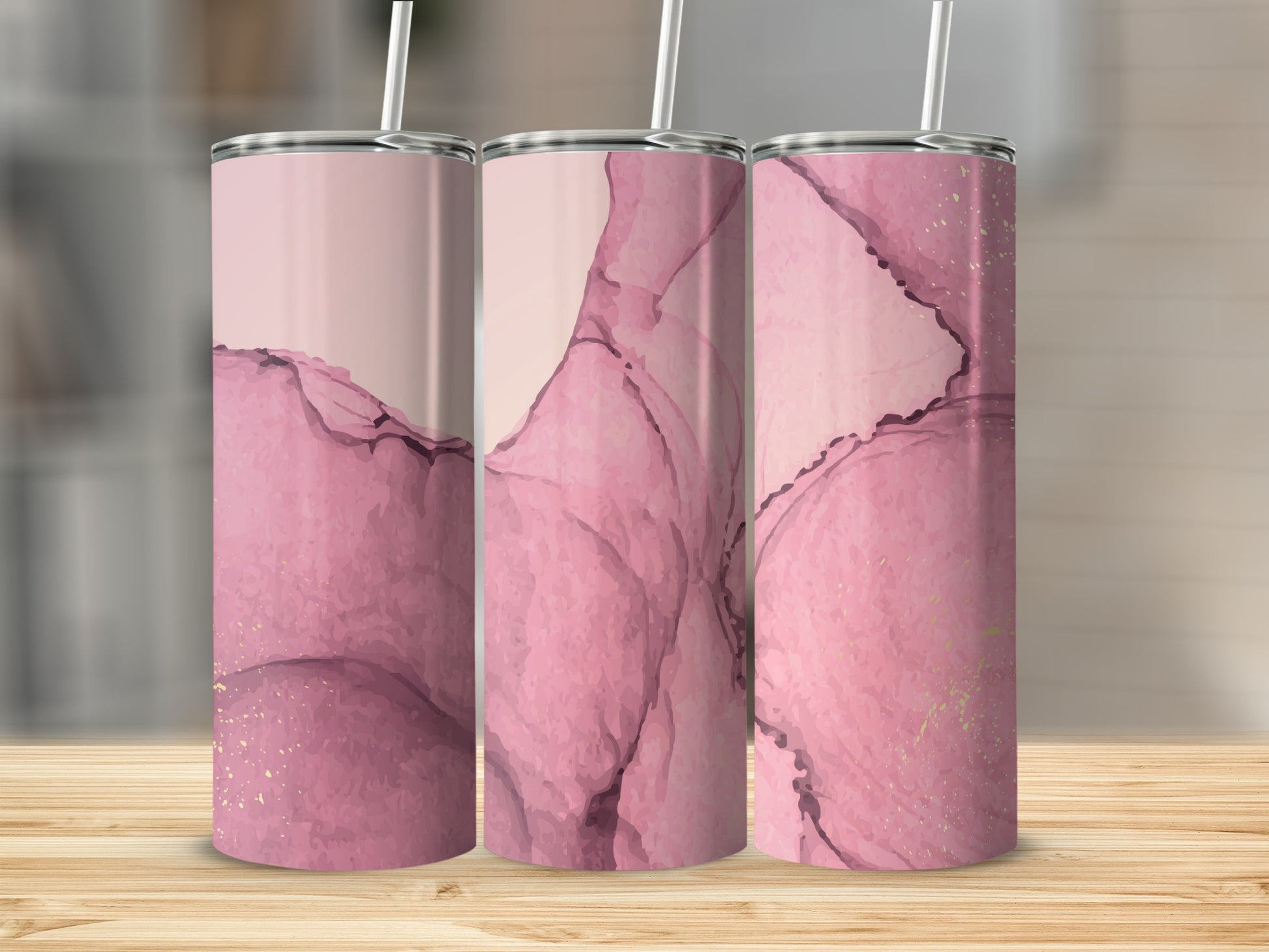 Three pink abstract marble pattern tumblers with gold flecks.