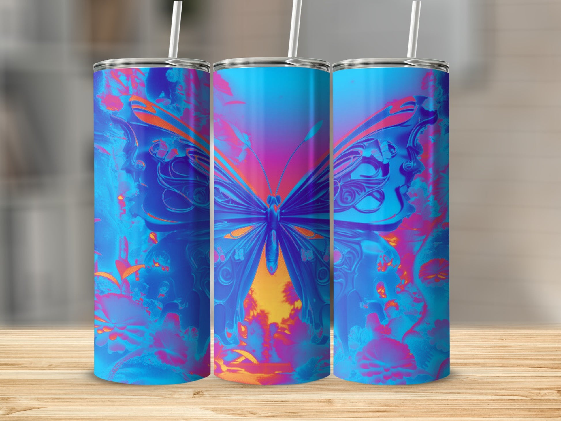 Three tumblers featuring a vibrant blue and orange butterfly design.