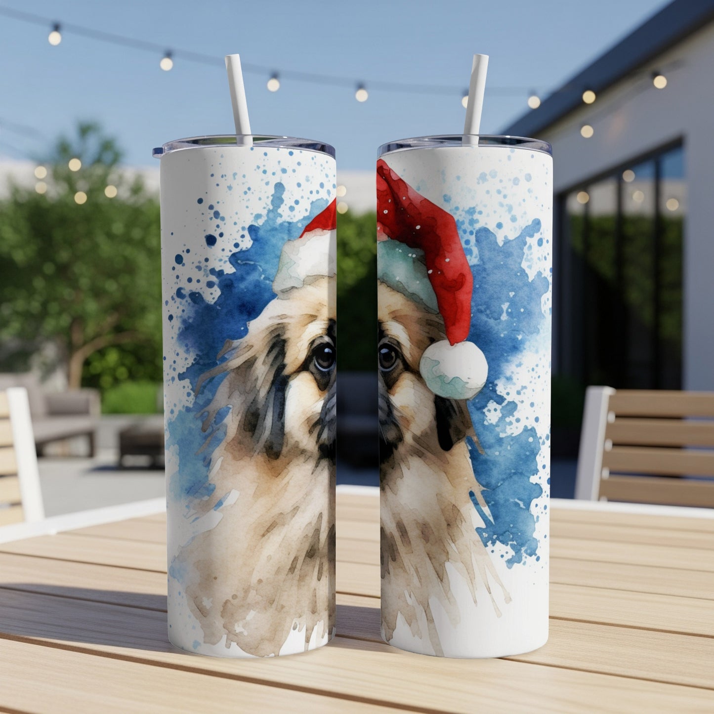 Two tumblers featuring a watercolor painting of a dog wearing a Santa hat.