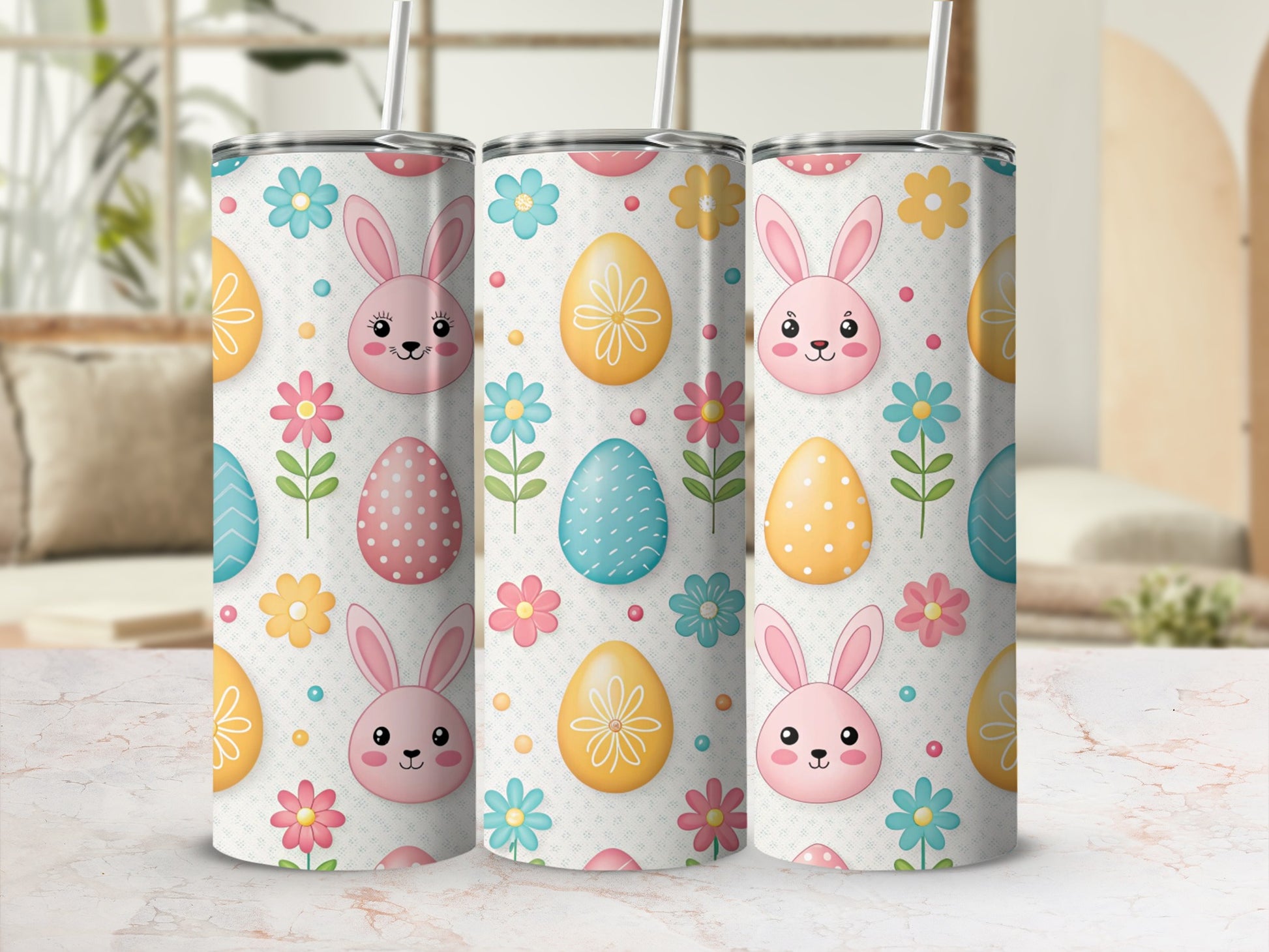 Easter bunny and egg pattern on three tumblers with straws.