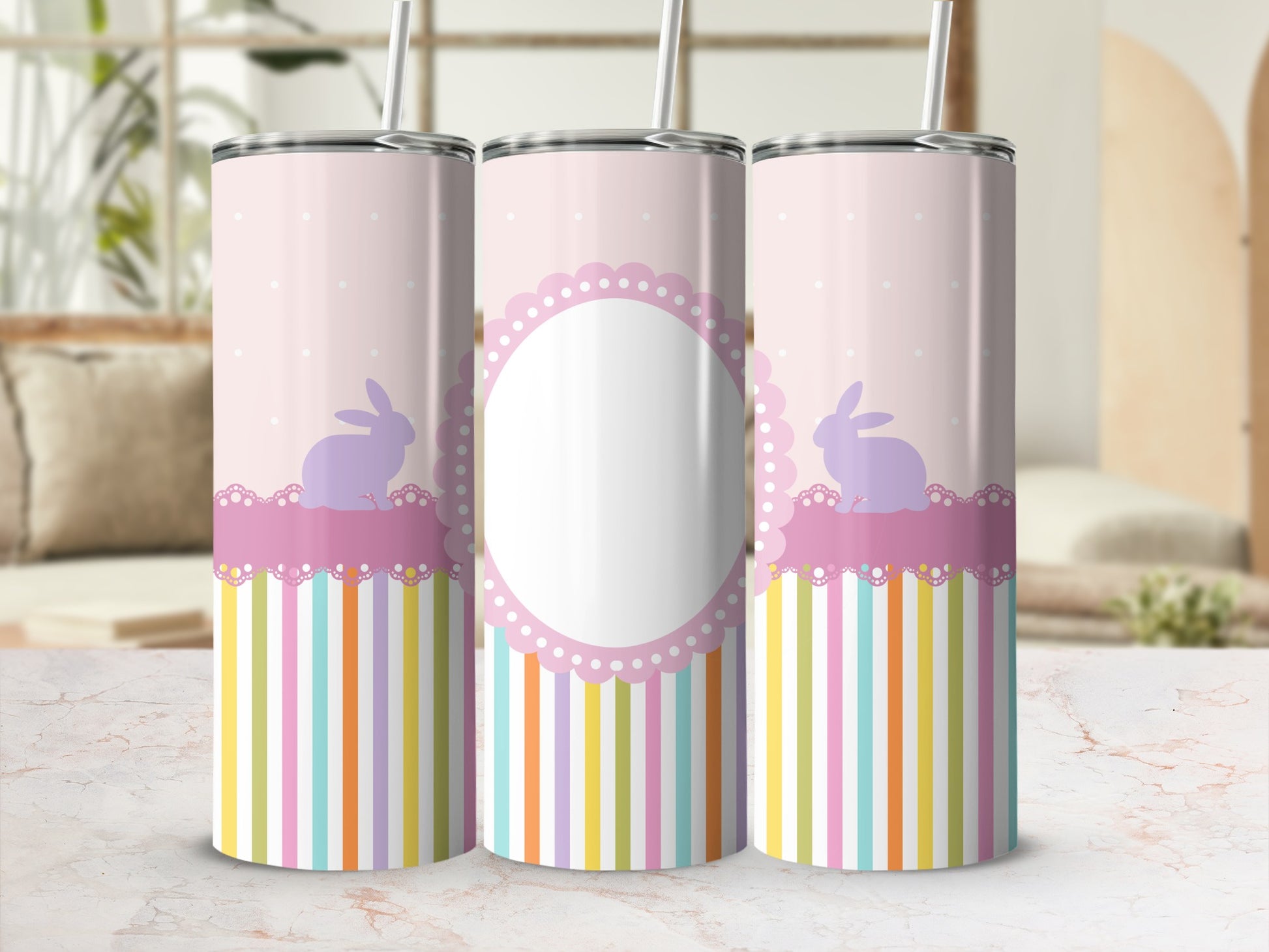 Three pastel bunny-themed tumblers with striped bases and decorative scalloped frames.