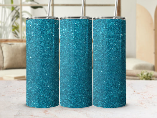 Three turquoise glitter tumblers with straws stand on a marble surface.