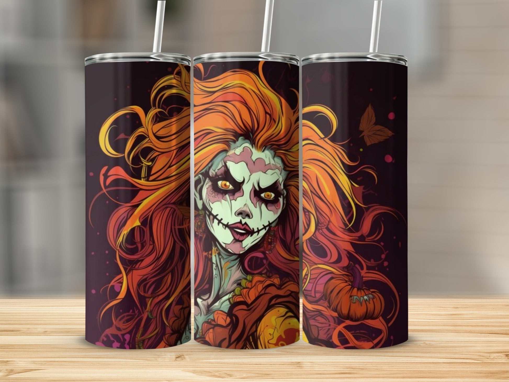 Three tumblers with a Halloween-themed illustration of a woman with fiery orange hair.