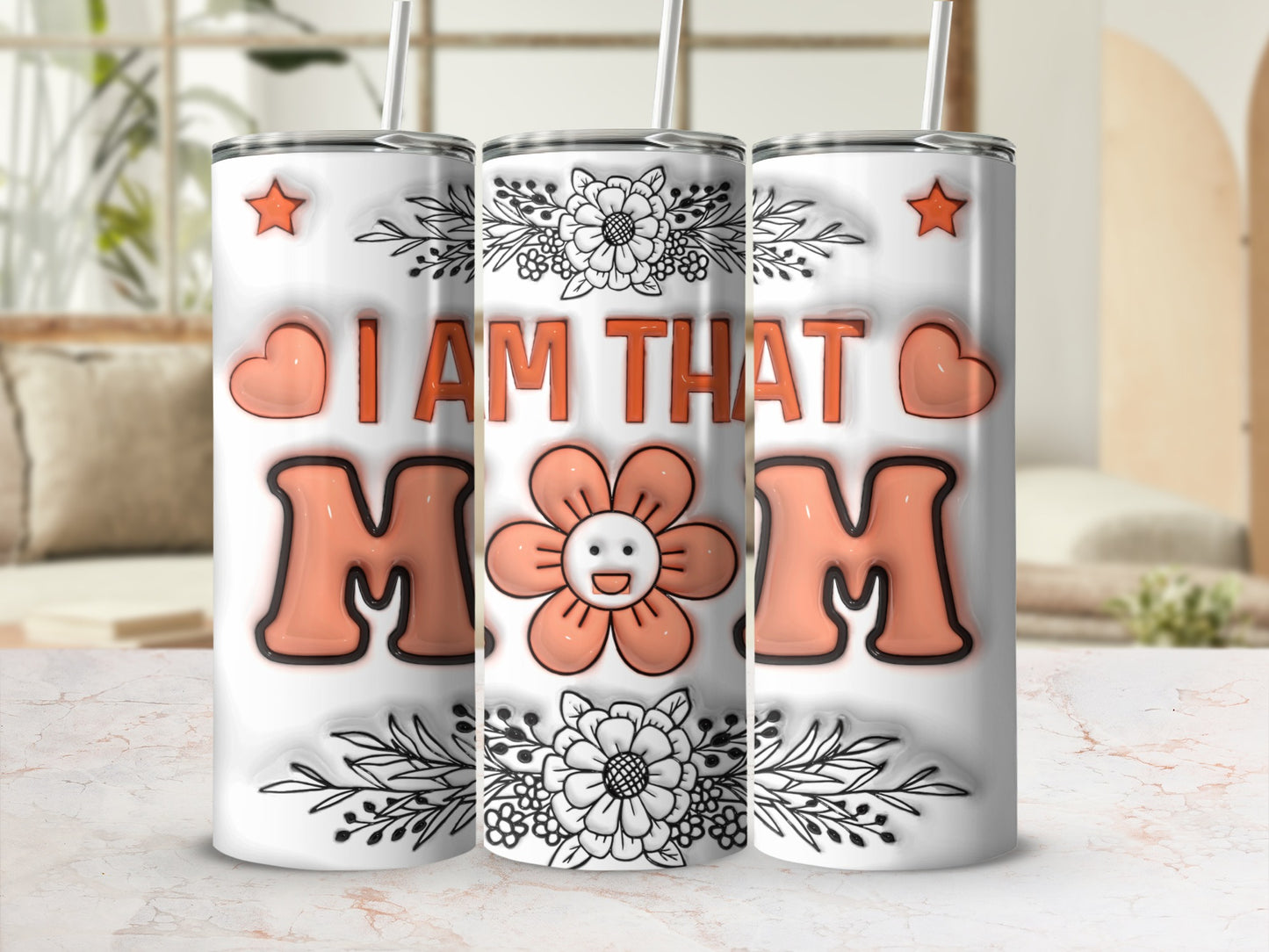 Tumbler with "I AM THAT MOM" text and floral and heart graphics.