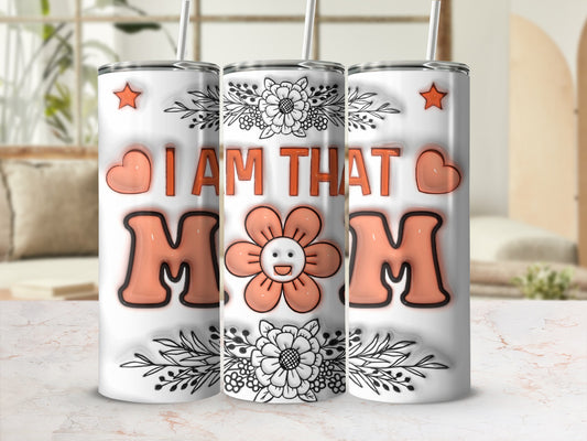 Tumbler with "I AM THAT MOM" text and floral and heart graphics.
