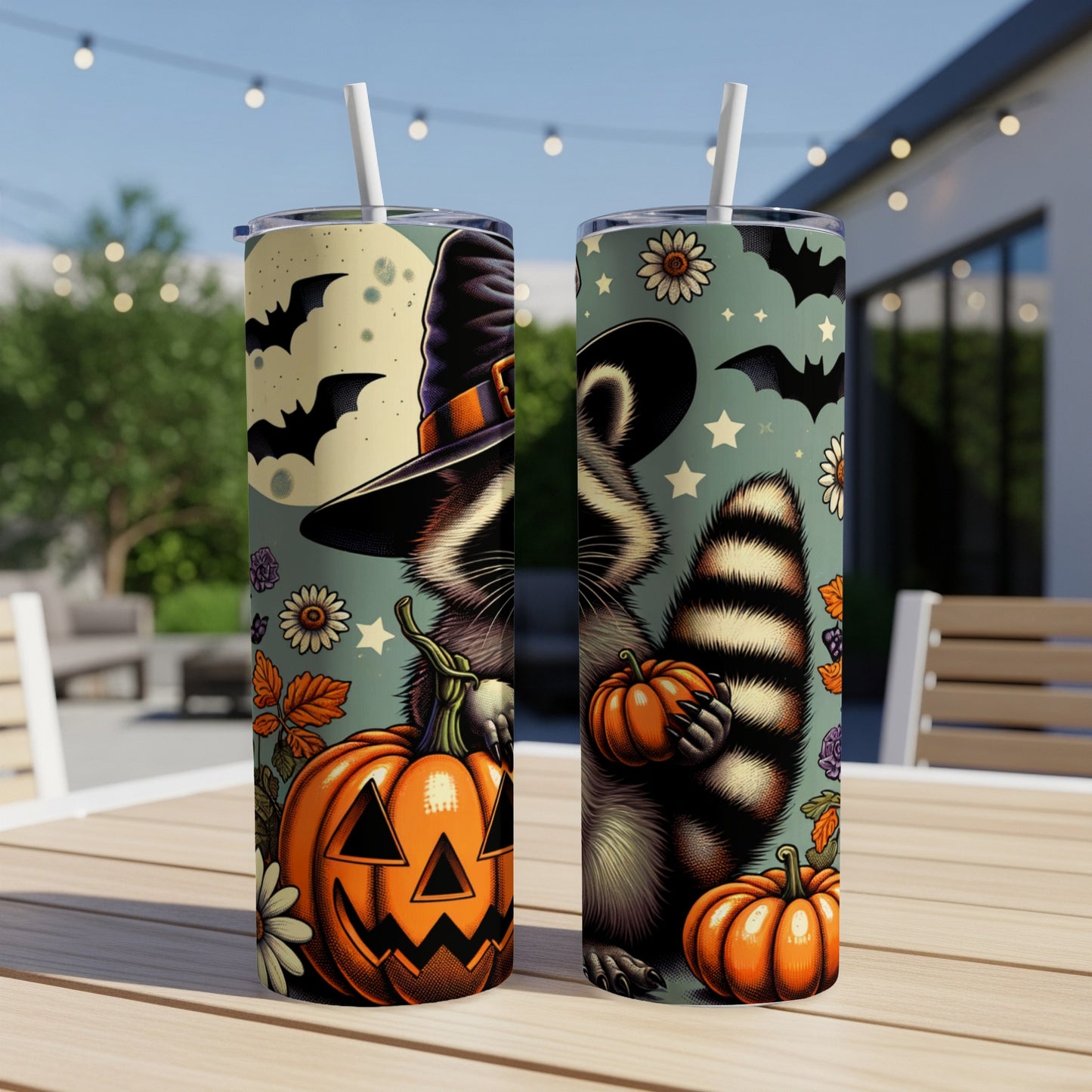 Two tumblers with a Halloween raccoon design, pumpkins, bats, and autumn leaves.