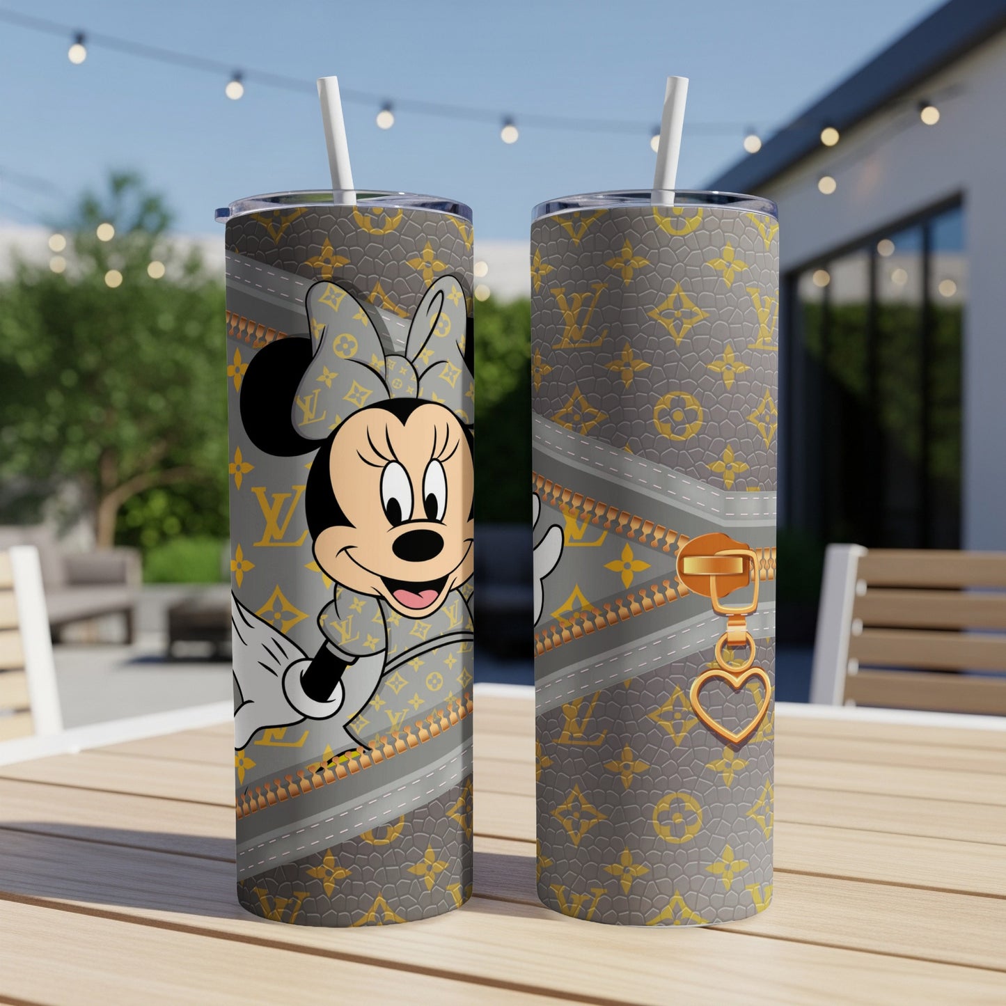 Minnie Mouse wearing designer pattern on tumbler with golden zipper and heart charm.