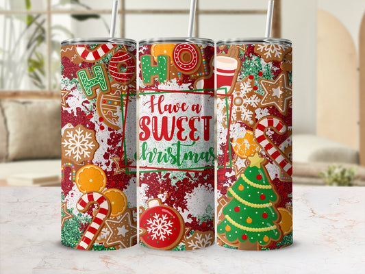 Christmas tumbler with gingerbread cookies, candy canes, and festive text.