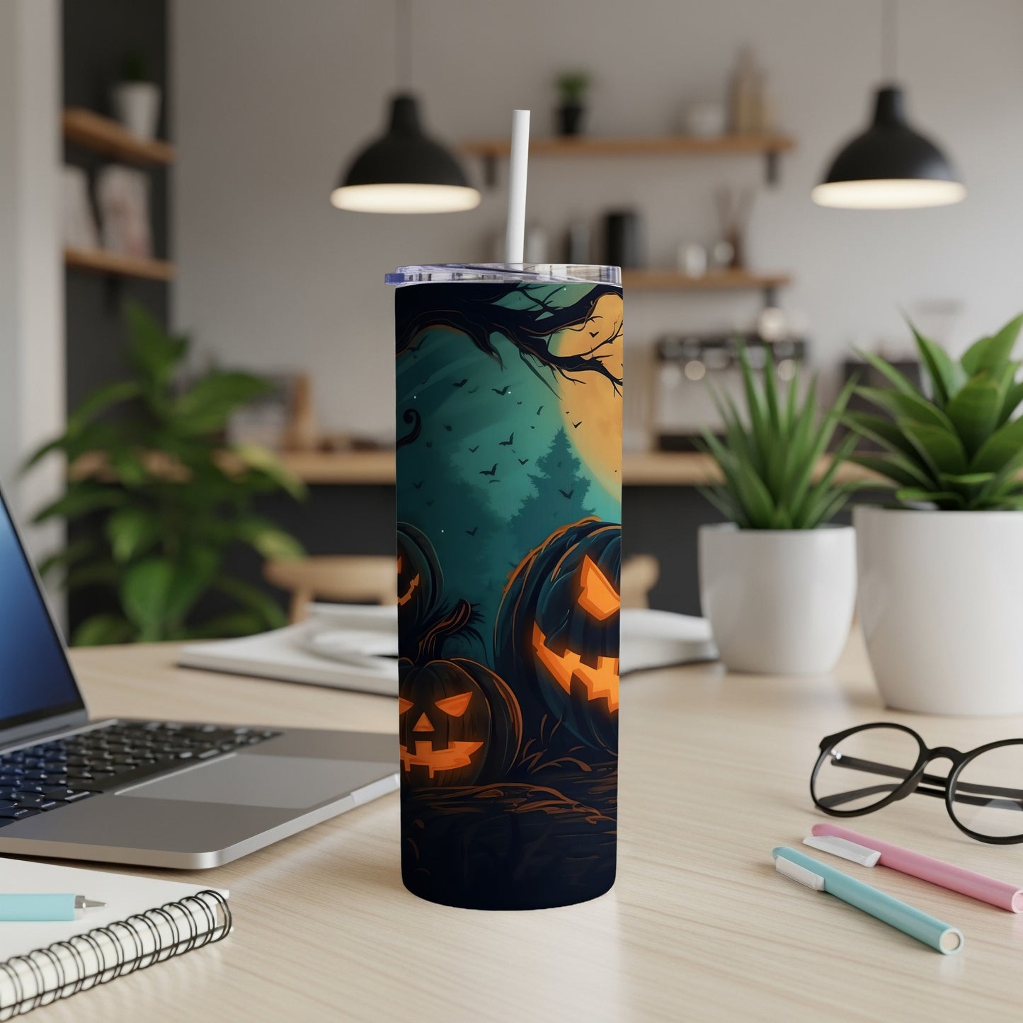 Tumbler with glowing jack-o'-lanterns, bats, and full moon Halloween design.