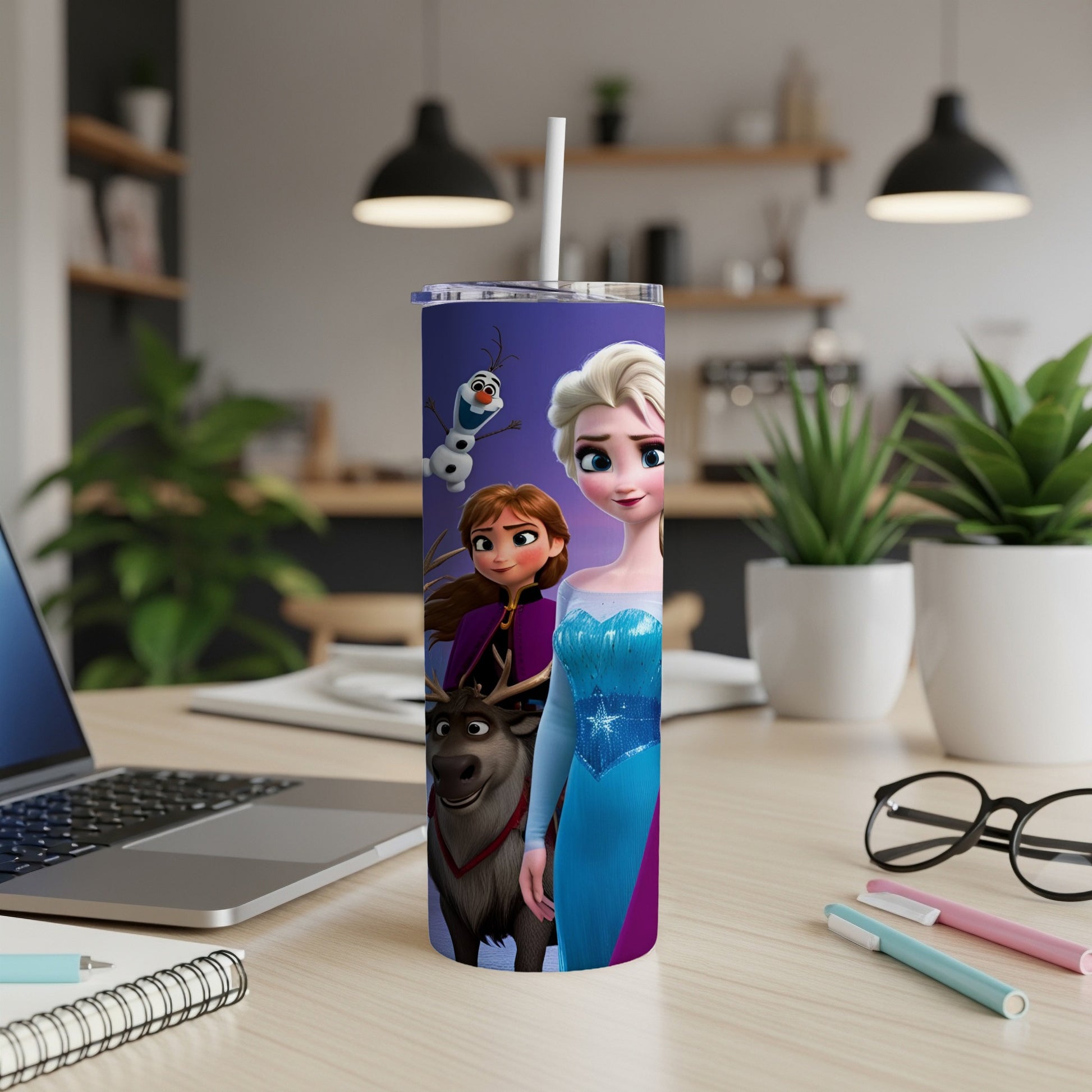 Elsa, Anna, and Olaf from Frozen on a purple tumbler with a blue, pink, and silver design.