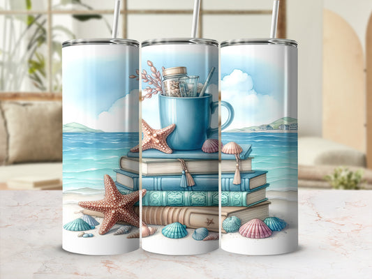 Beach-themed tumbler with stacked books, seashells, and a mug.