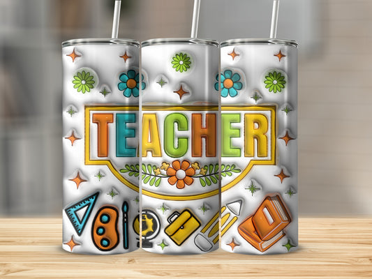 White tumbler with "TEACHER" in colorful block letters and school icons.
