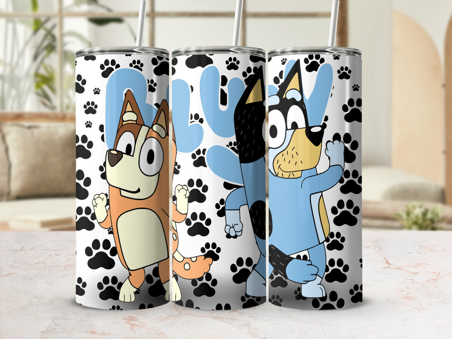 Three Bluey characters on colorful tumblers with paw prints and "Bluey" text.