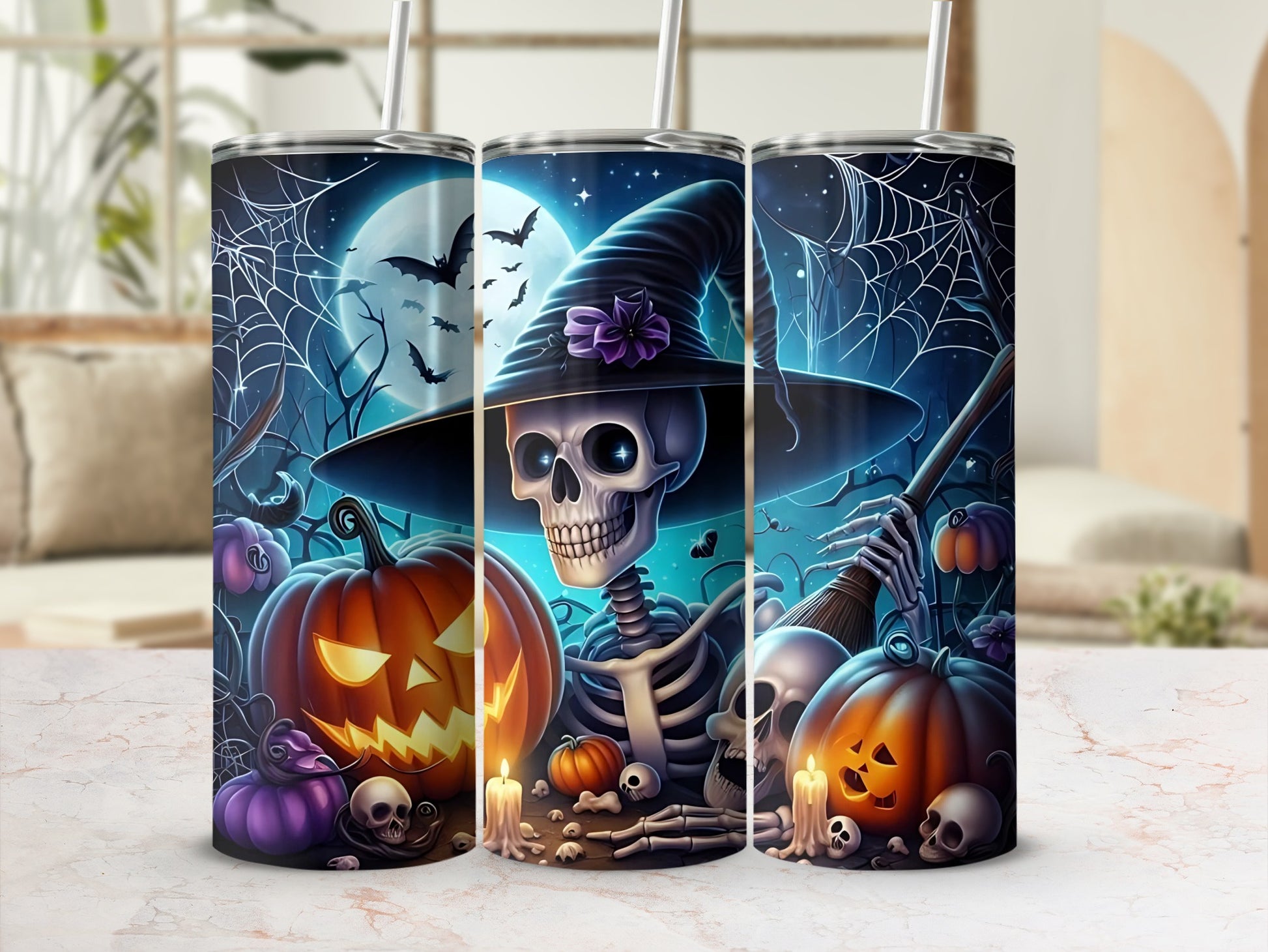 Three tumblers with Halloween skeleton, pumpkins, bats, and spooky scene designs.