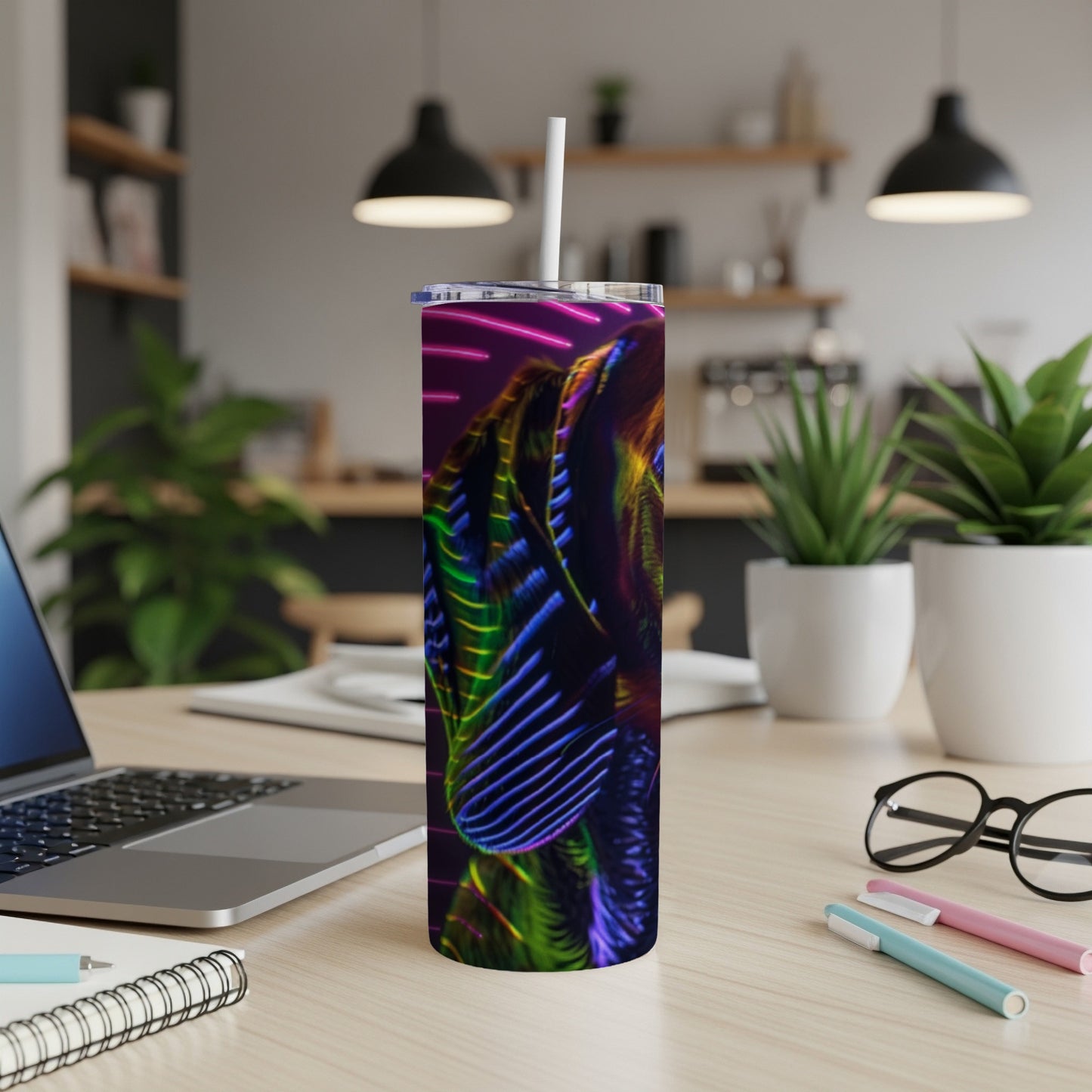 Abstract colorful pattern on a tumbler with a straw.