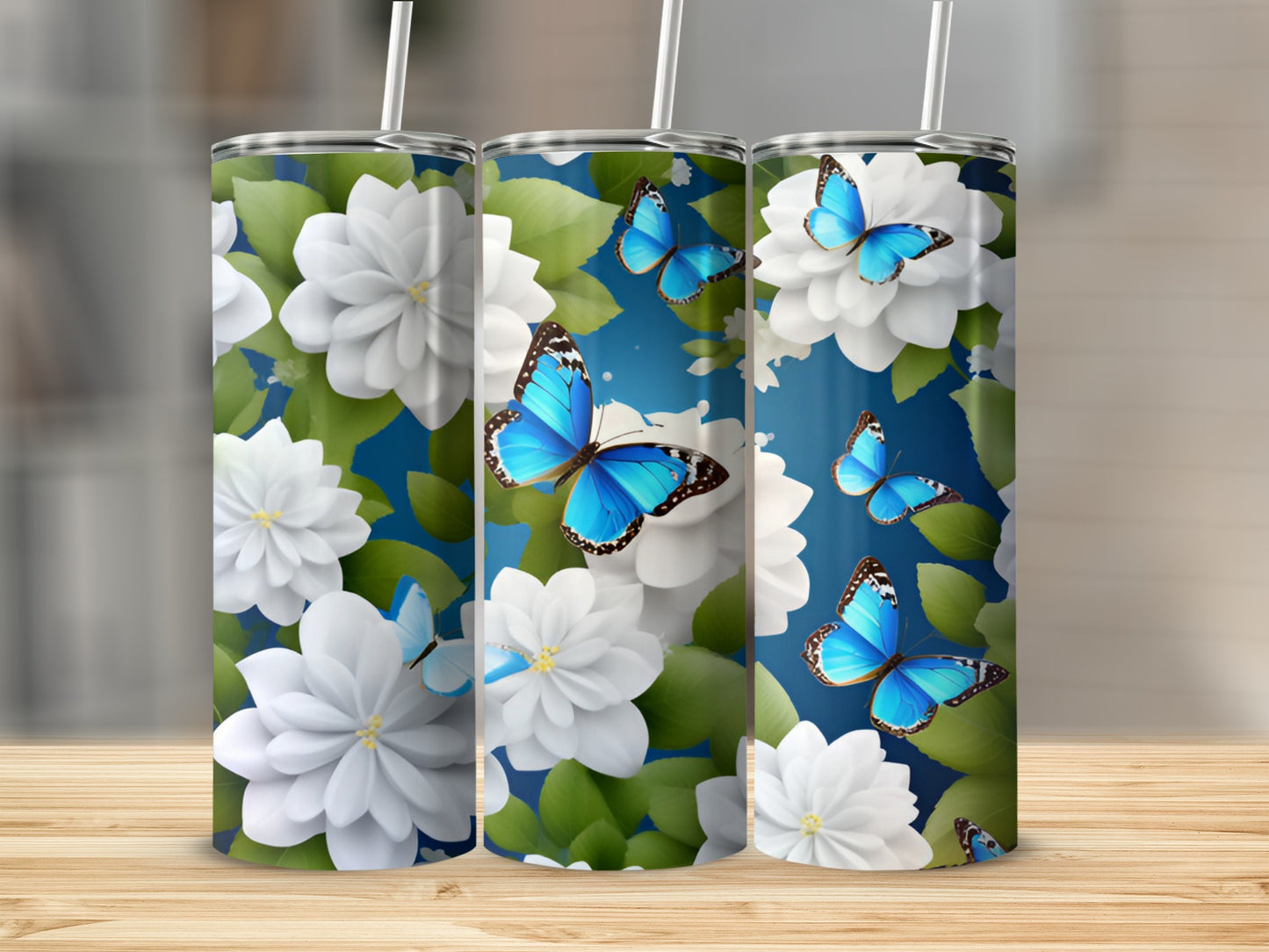 White flowers and blue butterflies on a teal background, three tumblers.