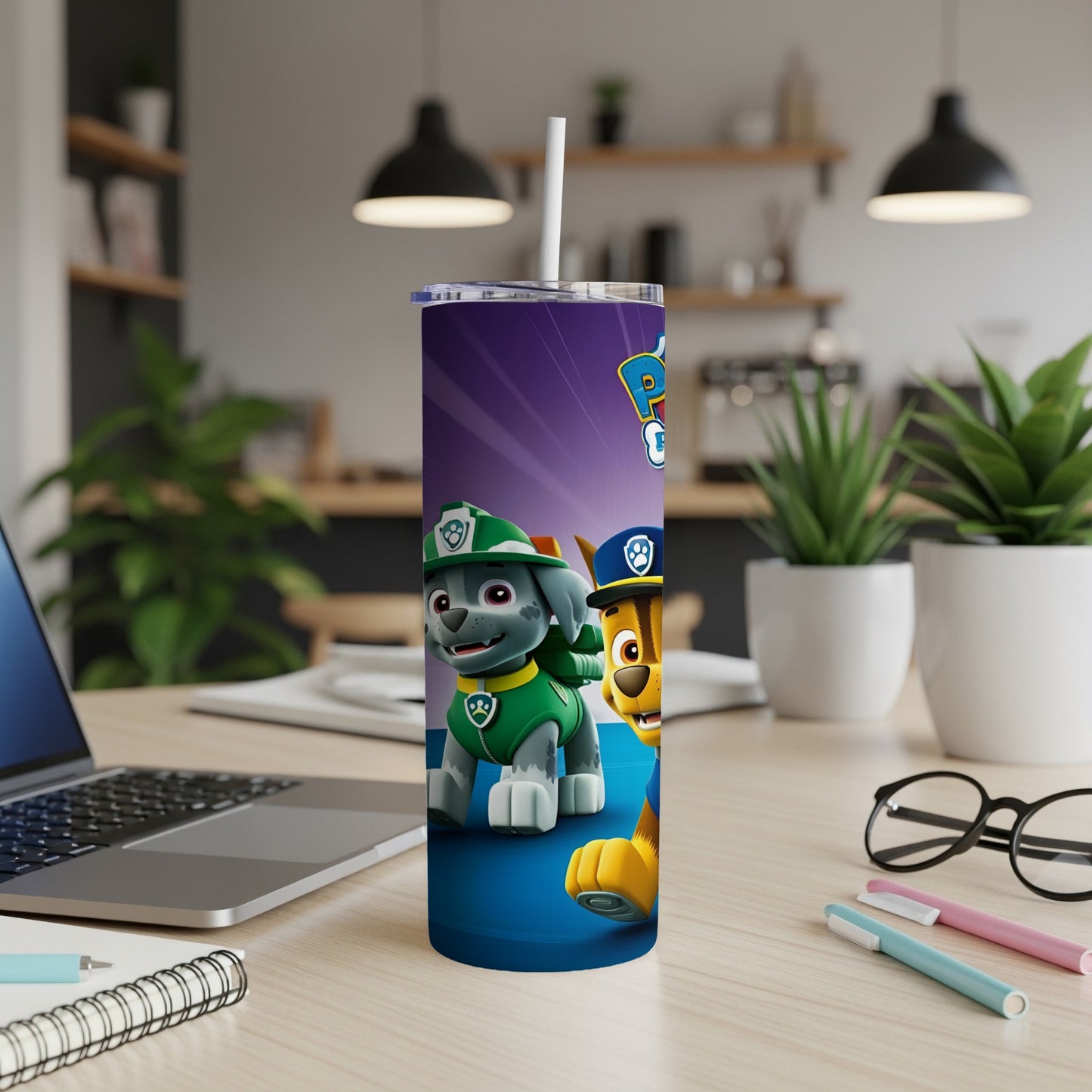 Paw Patrol characters Chase and Marshall on a purple and blue tumbler.