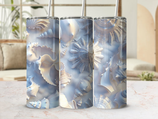 Three tumblers featuring a detailed seashell pattern in soft blues and whites.
