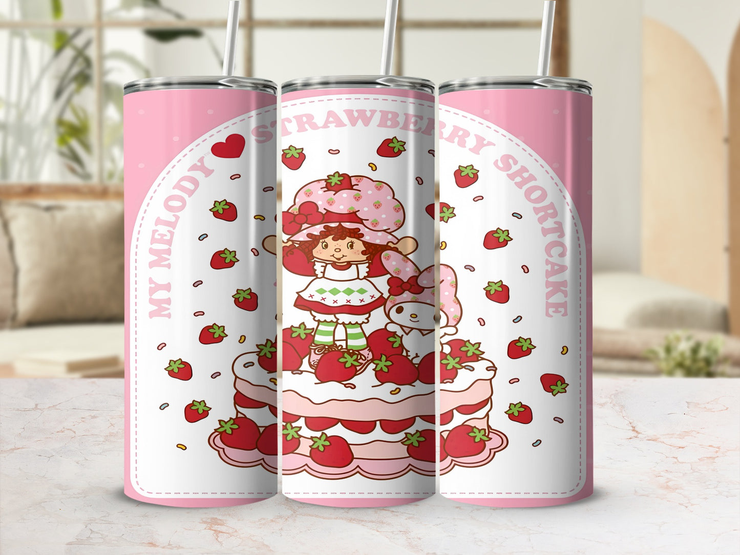 Strawberry Shortcake character with Hello Kitty on a tiered cake.