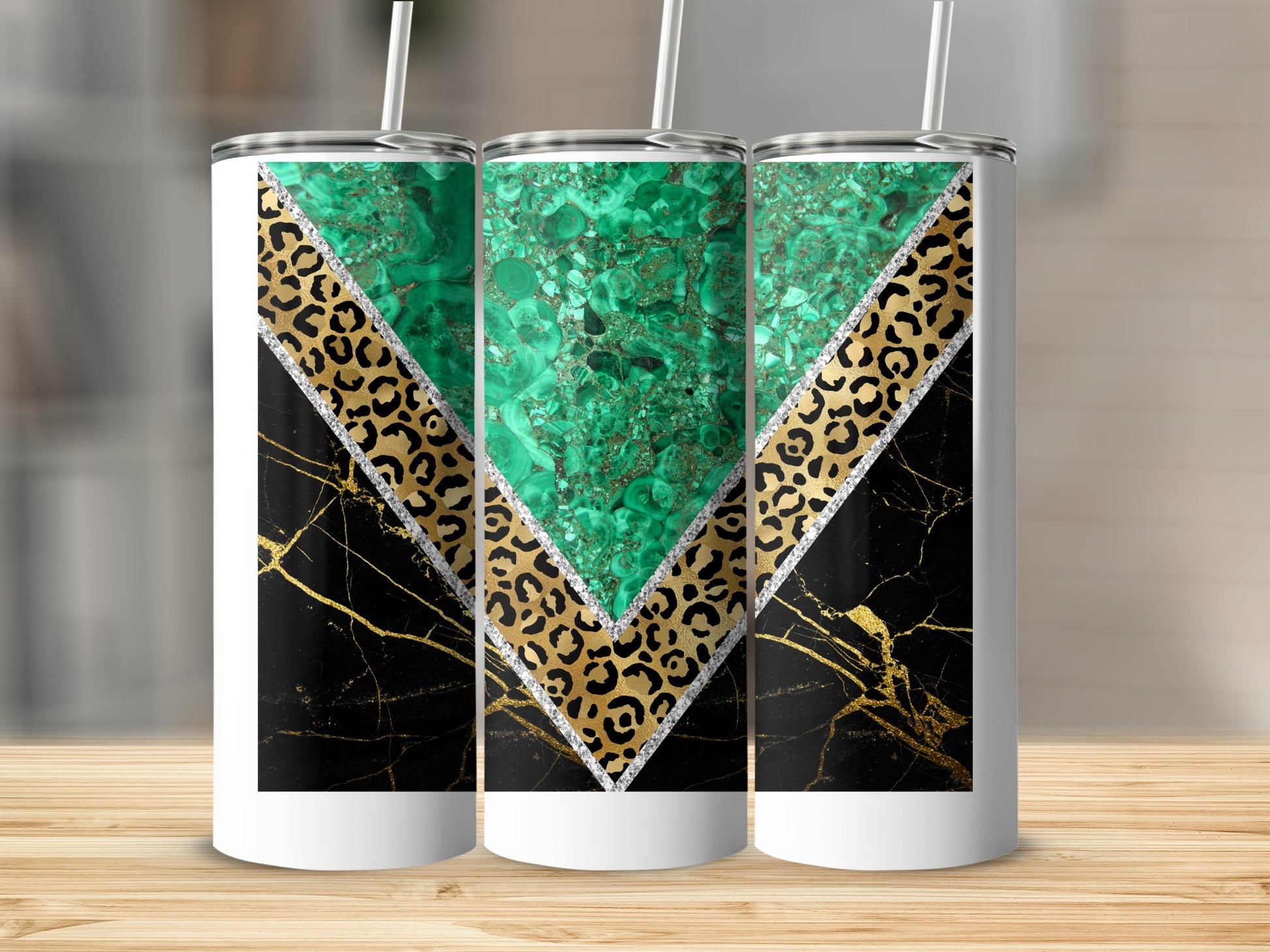 Three tumblers with green marble, leopard print, and black marble designs.