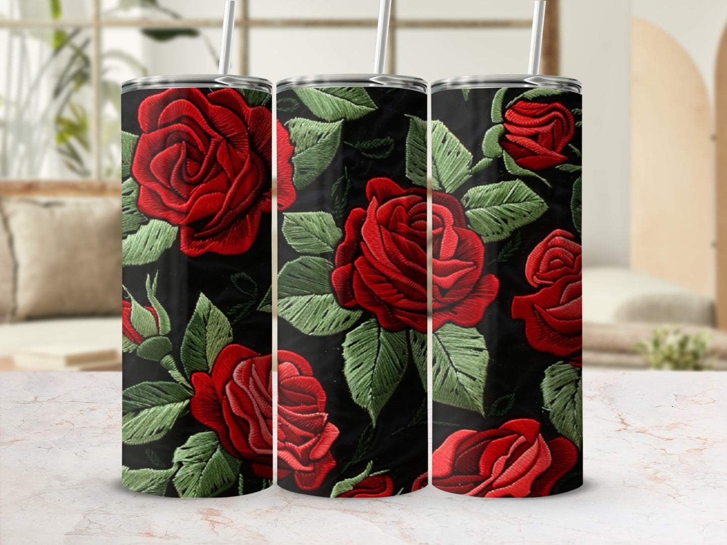 Black tumbler with embroidered red roses and green leaves.