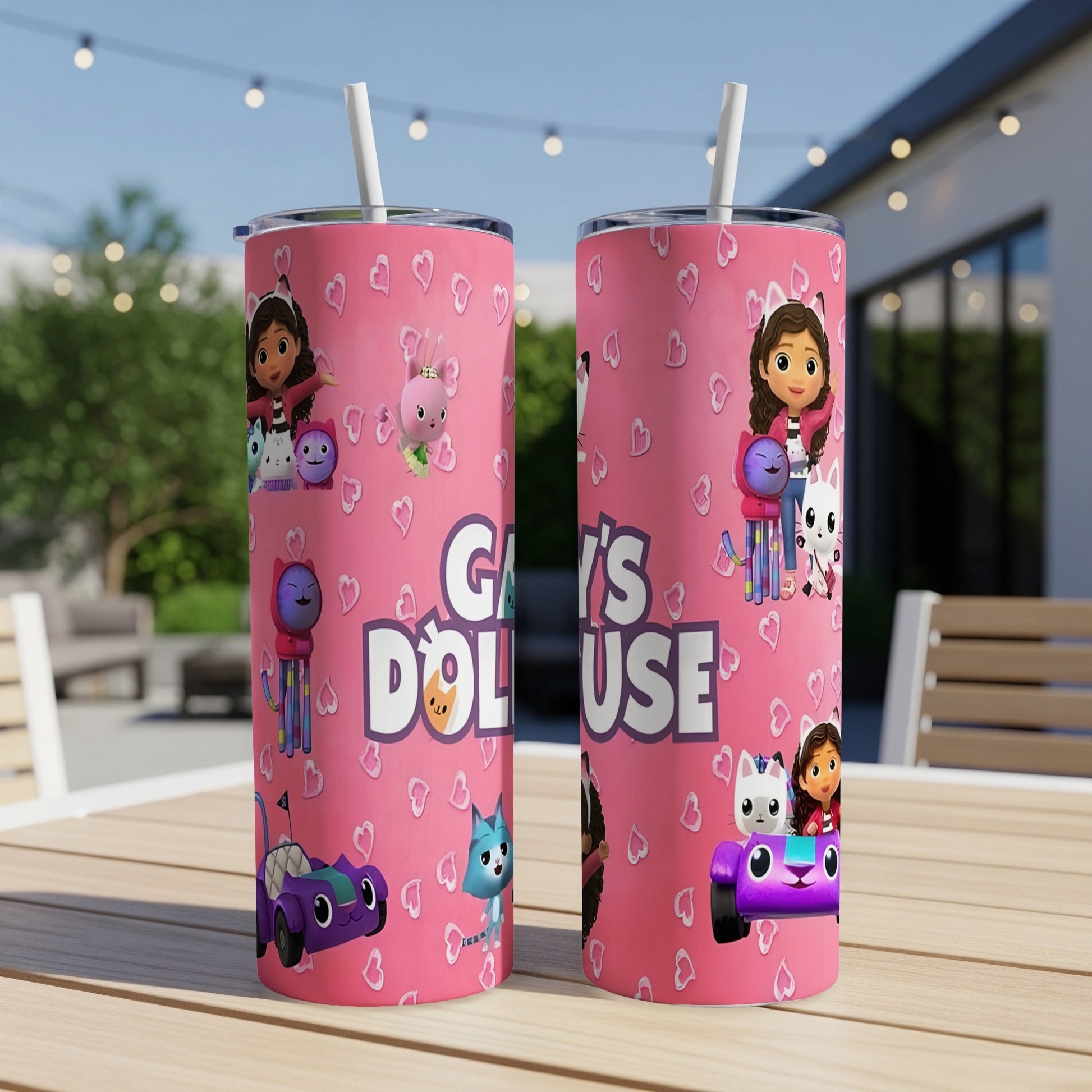 Two pink Gabby's Dollhouse tumblers with cartoon characters and text.
