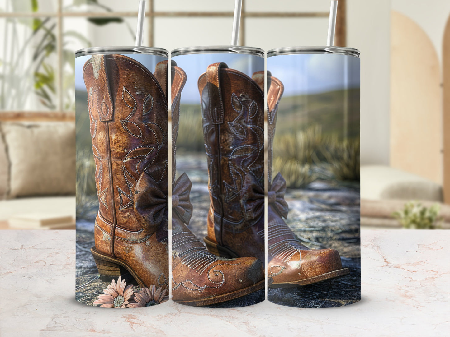 Brown leather cowboy boots with floral accents and straw background.