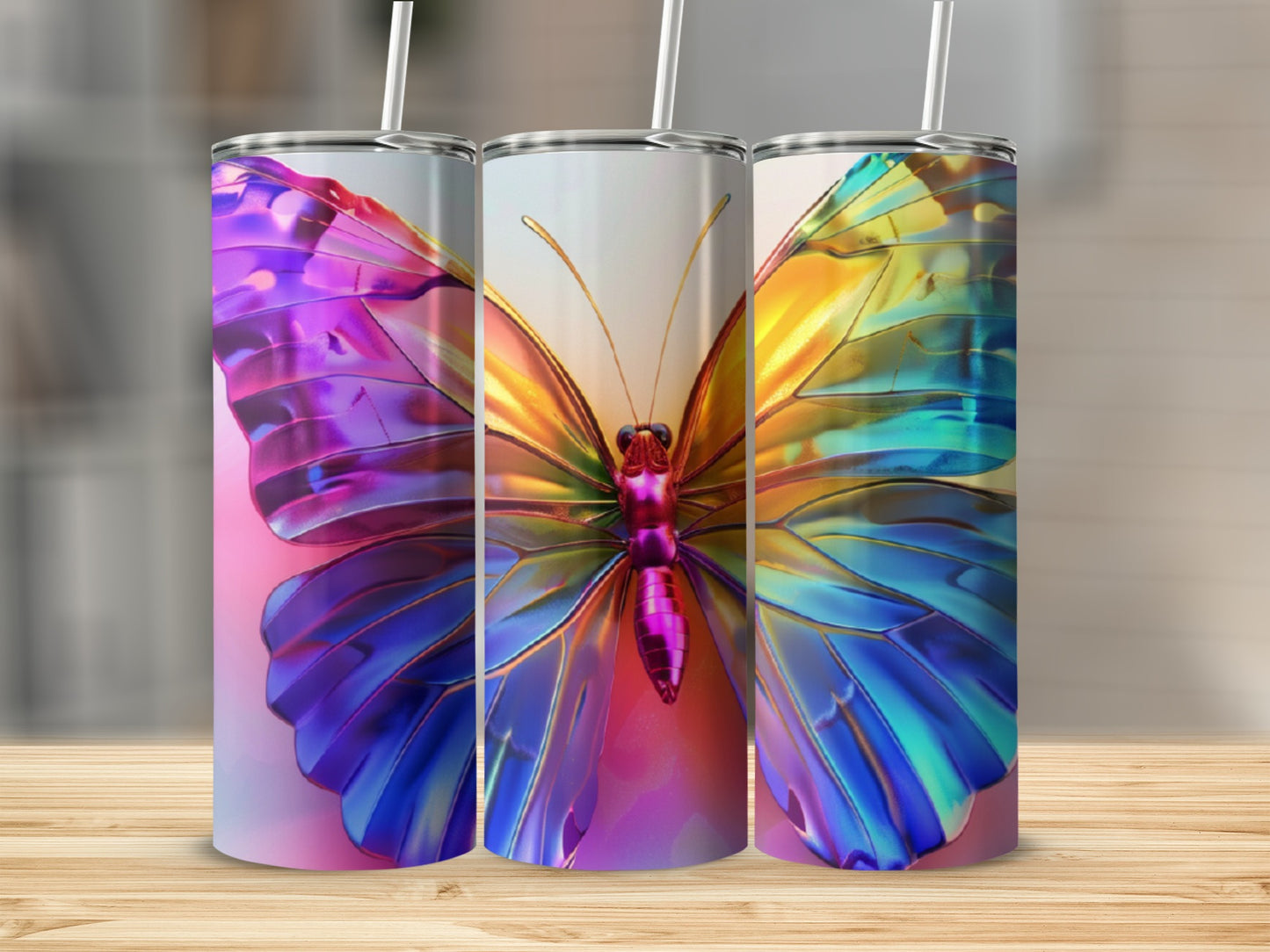 Three tumblers showing a colorful butterfly design.