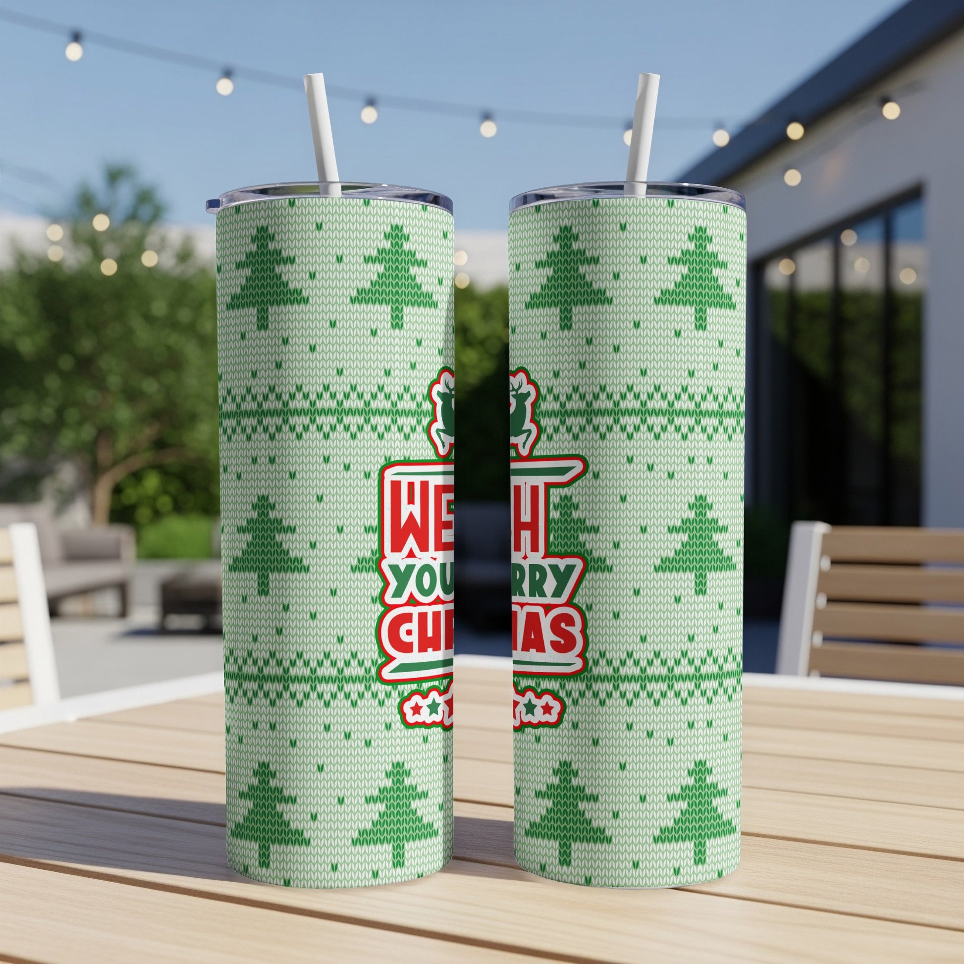 Two light green tumblers with Christmas tree pattern and "WE WISH YOU A MERRY CHRISTMAS" text.