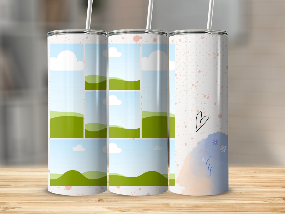 Three tumblers with different whimsical designs featuring clouds, green hills, and painted shapes.
