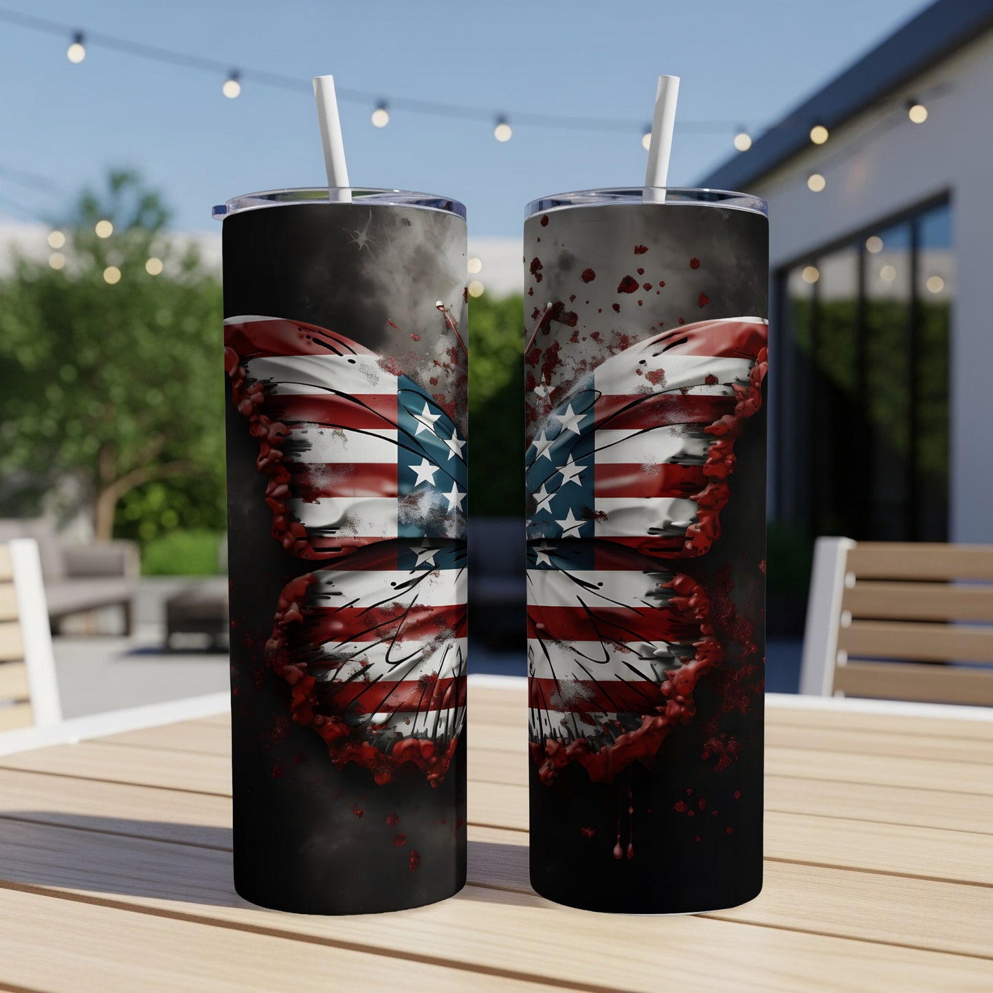 Two tumblers with an American flag butterfly design on an outdoor table.