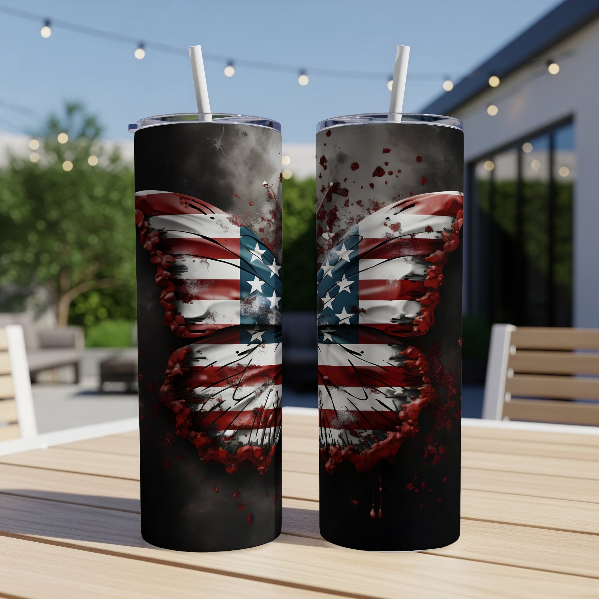 Two tumblers with an American flag butterfly design on an outdoor table.