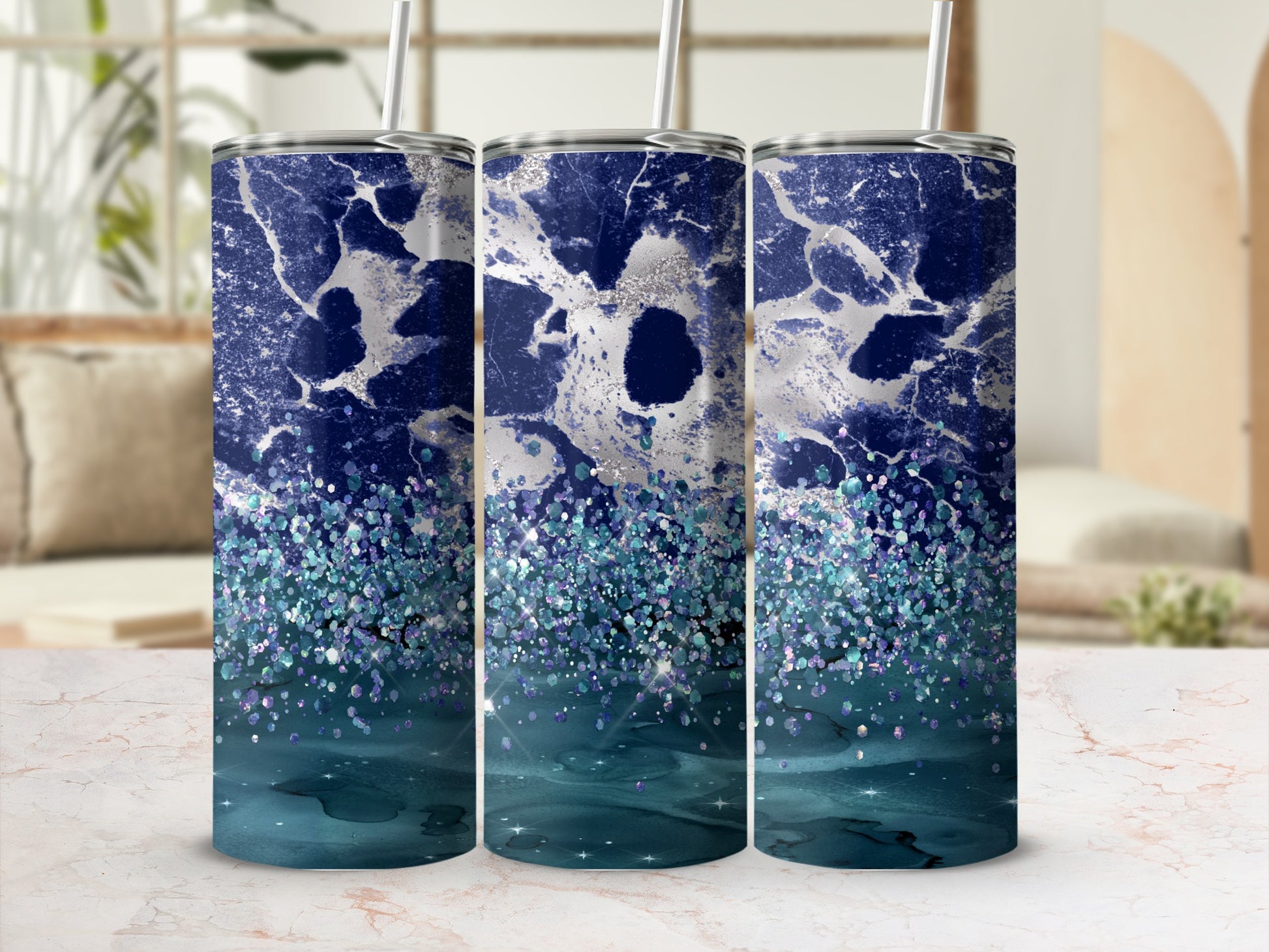 Three tumblers with a blue and silver marble and glitter design.