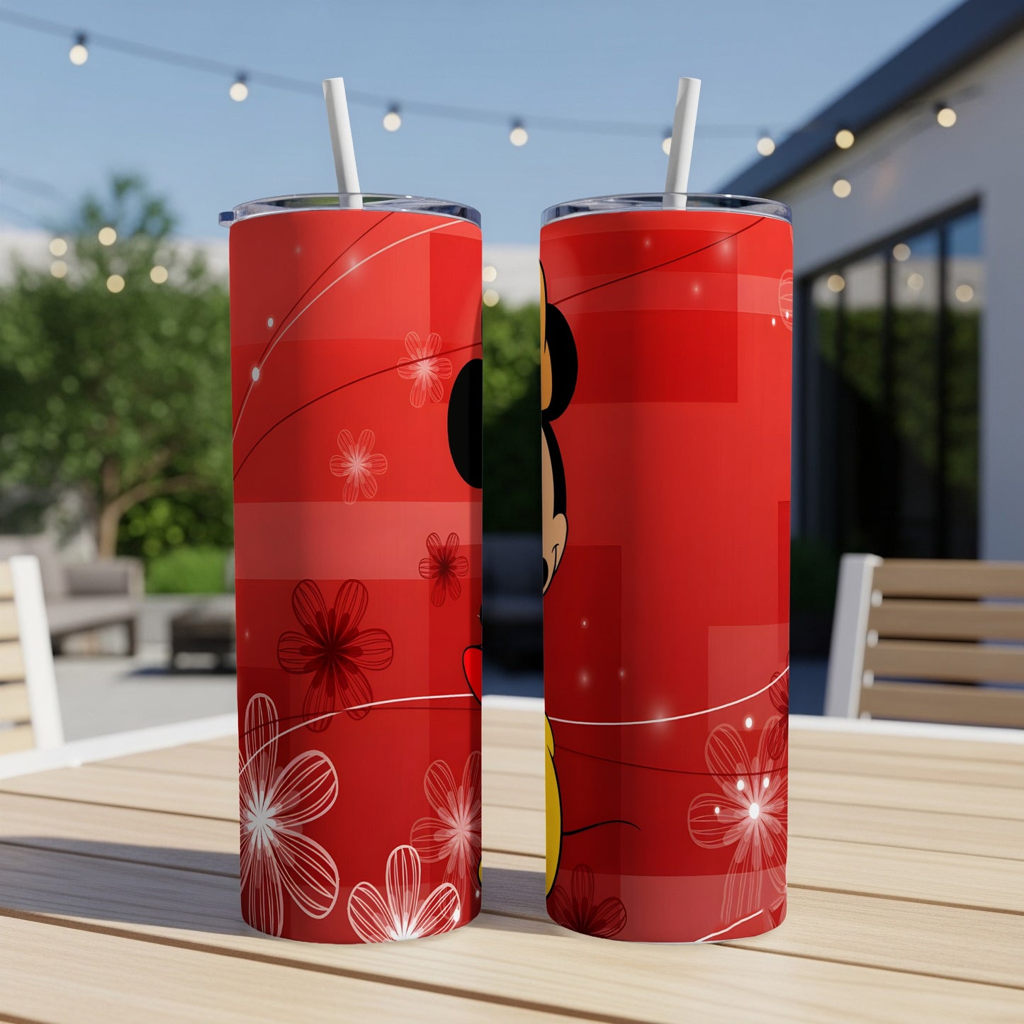 Two red tumblers with a Mickey Mouse silhouette and floral designs.