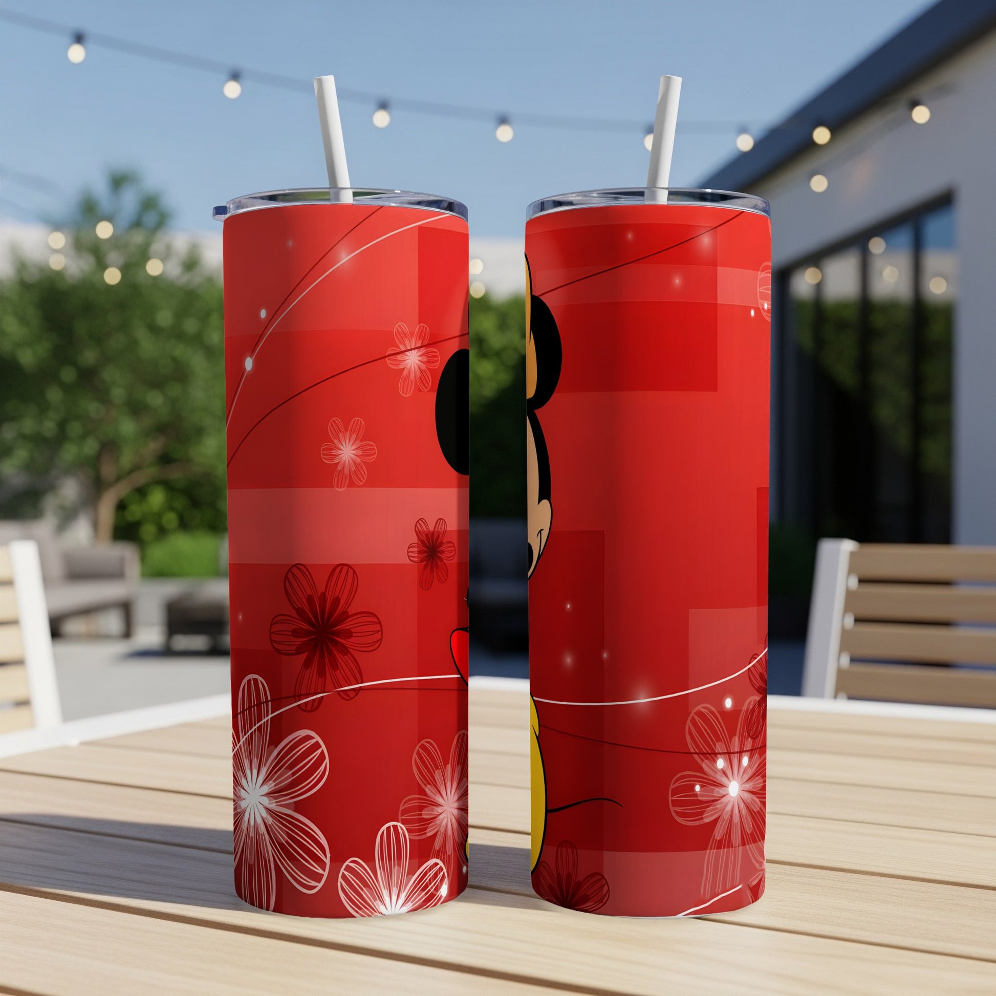 Two red tumblers with a Mickey Mouse silhouette and floral designs.