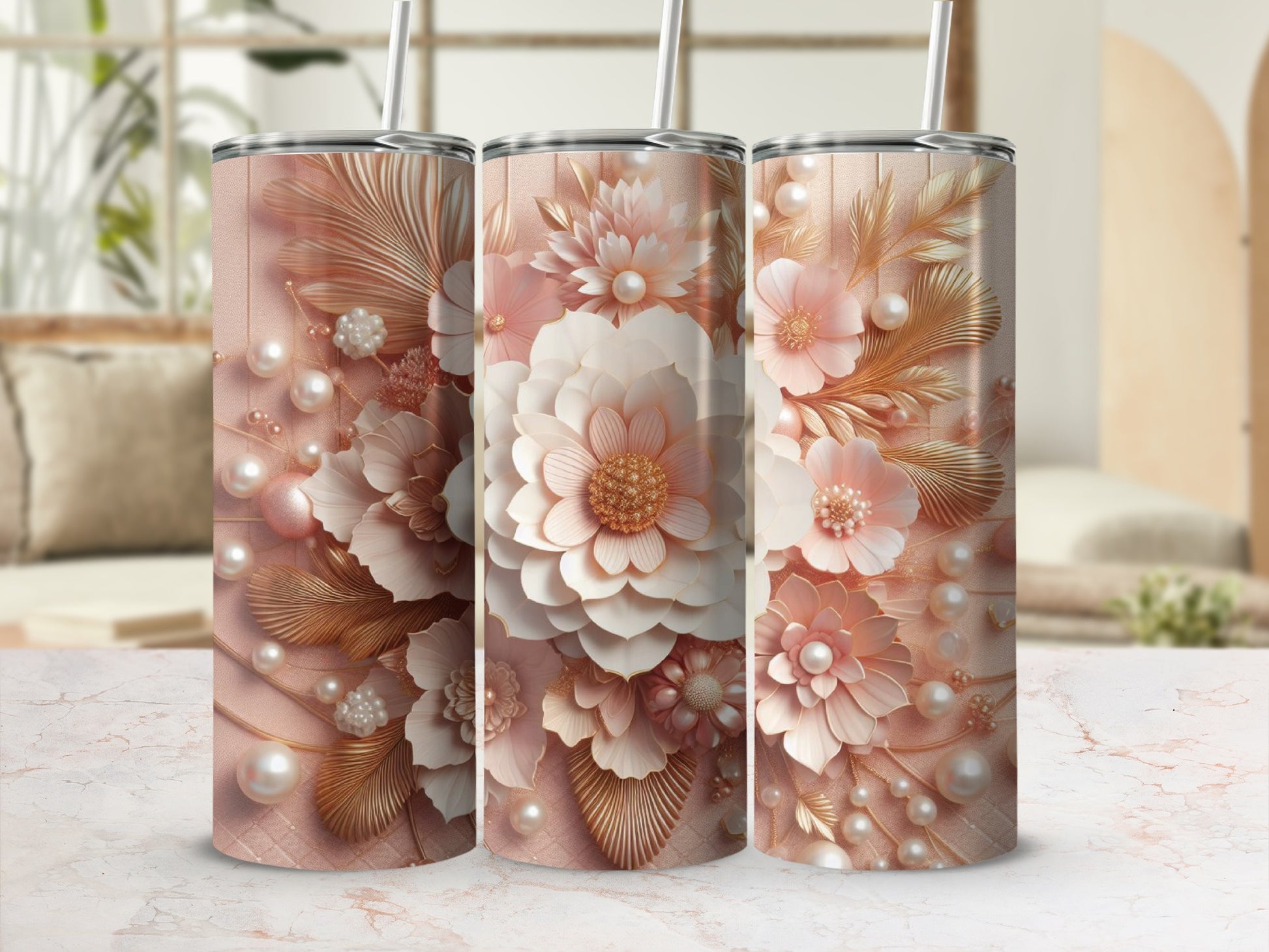 Three rose gold tumblers with intricate floral and pearl designs.