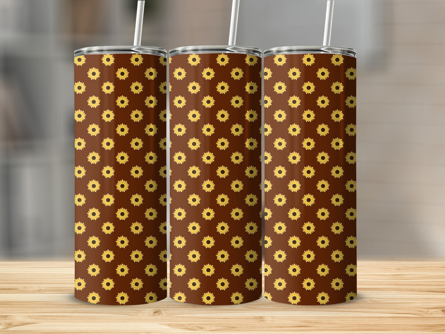 Three tumblers with a brown background and a repeating pattern of yellow sunflowers.