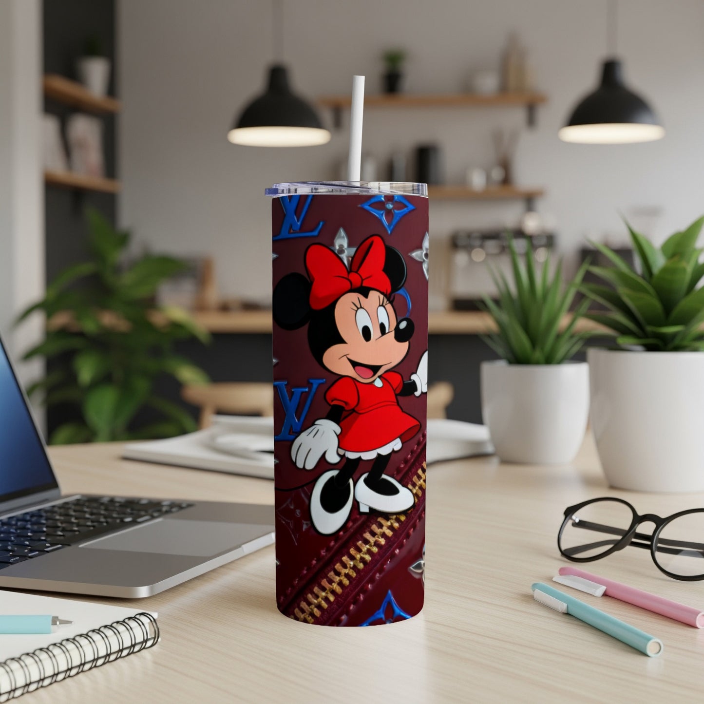 Minnie Mouse on a red Louis Vuitton patterned tumbler with straw.