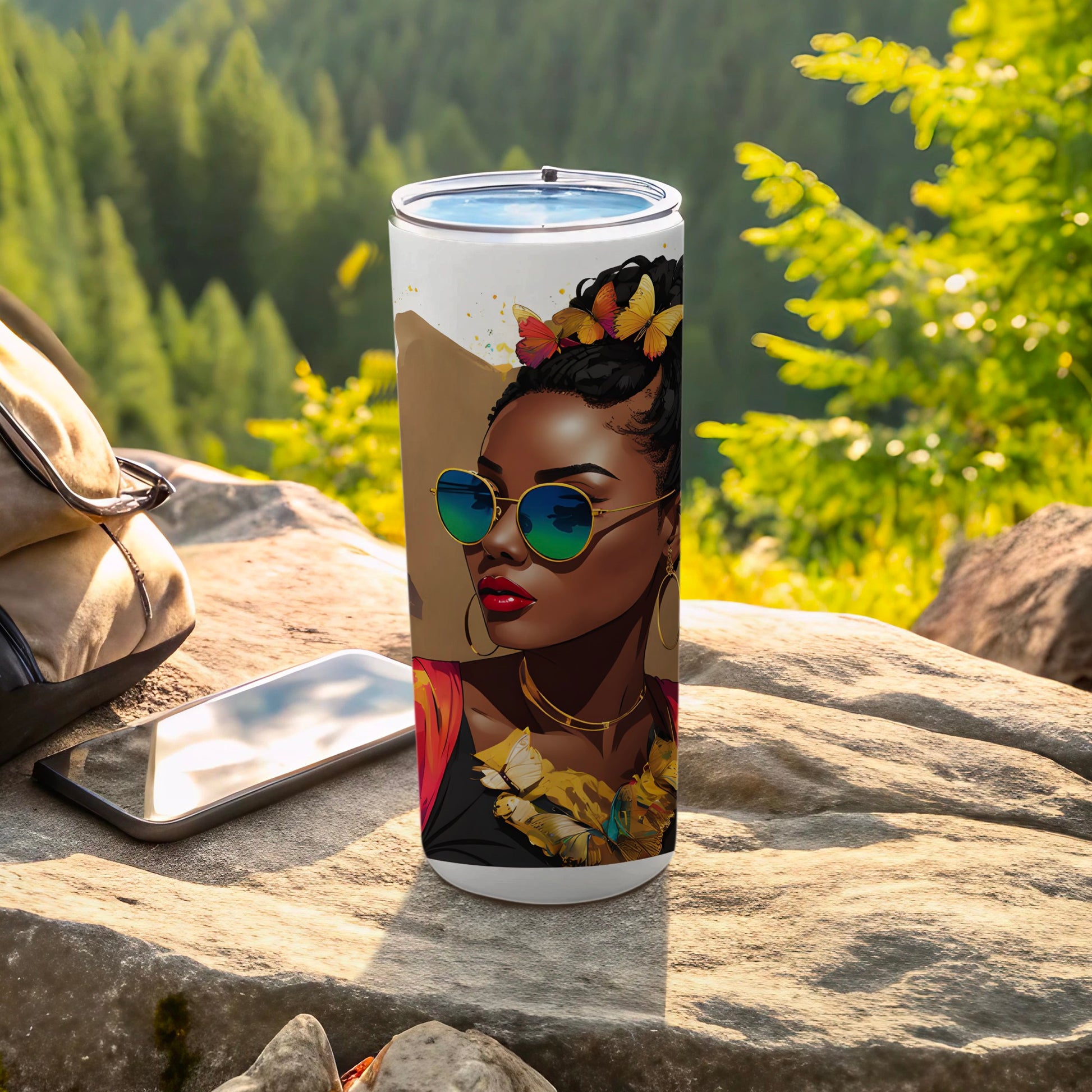 Tumbler featuring a woman with butterflies in her hair and sunglasses.