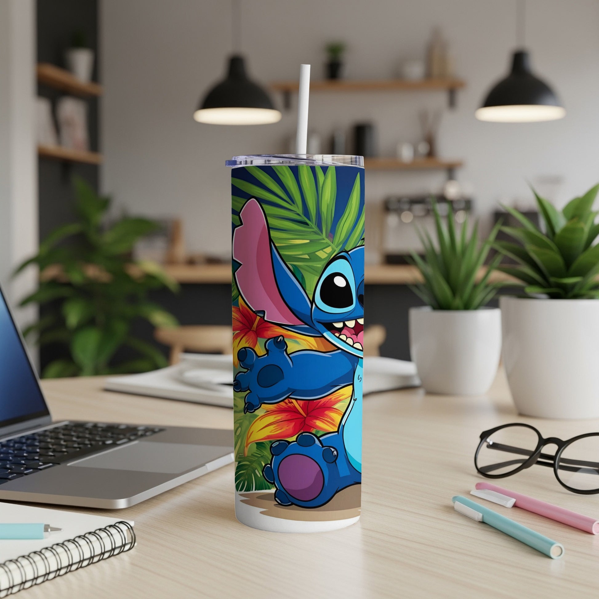 Stitch character on a tropical-themed tumbler with straw, on a desk.